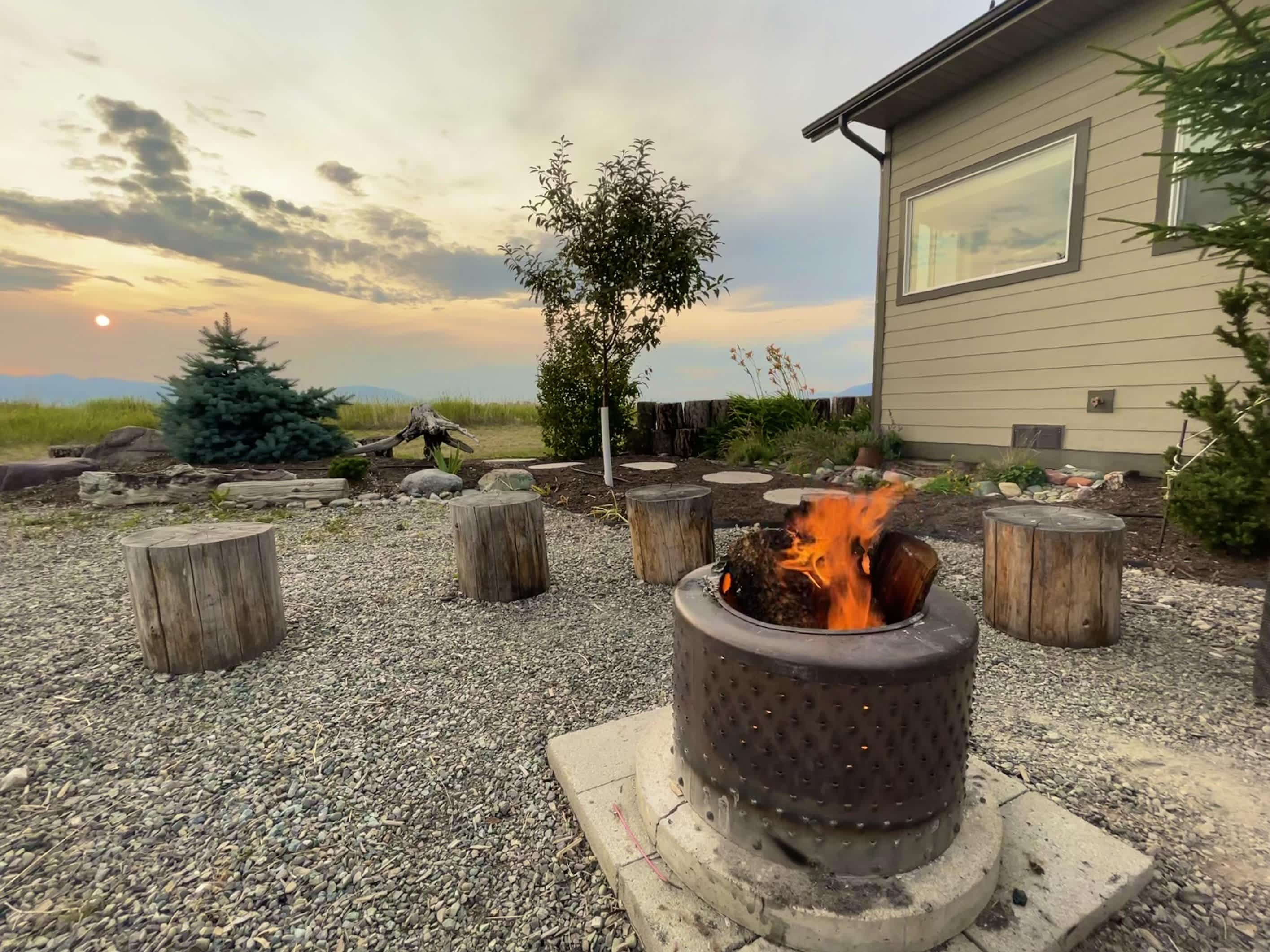 Gather around the warm glow of the outdoor firepit