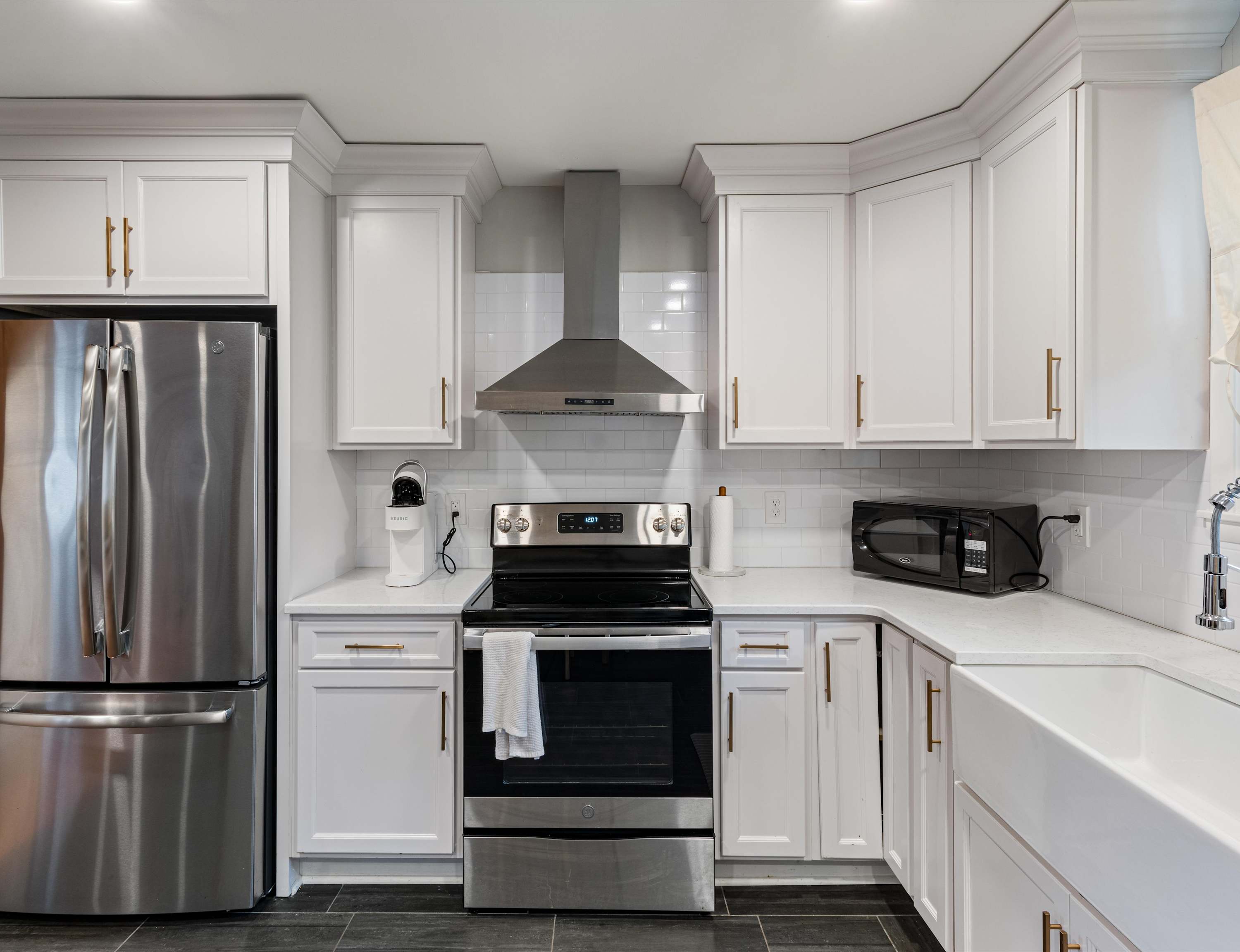 The open, airy kitchen offers ample space & every home comfort