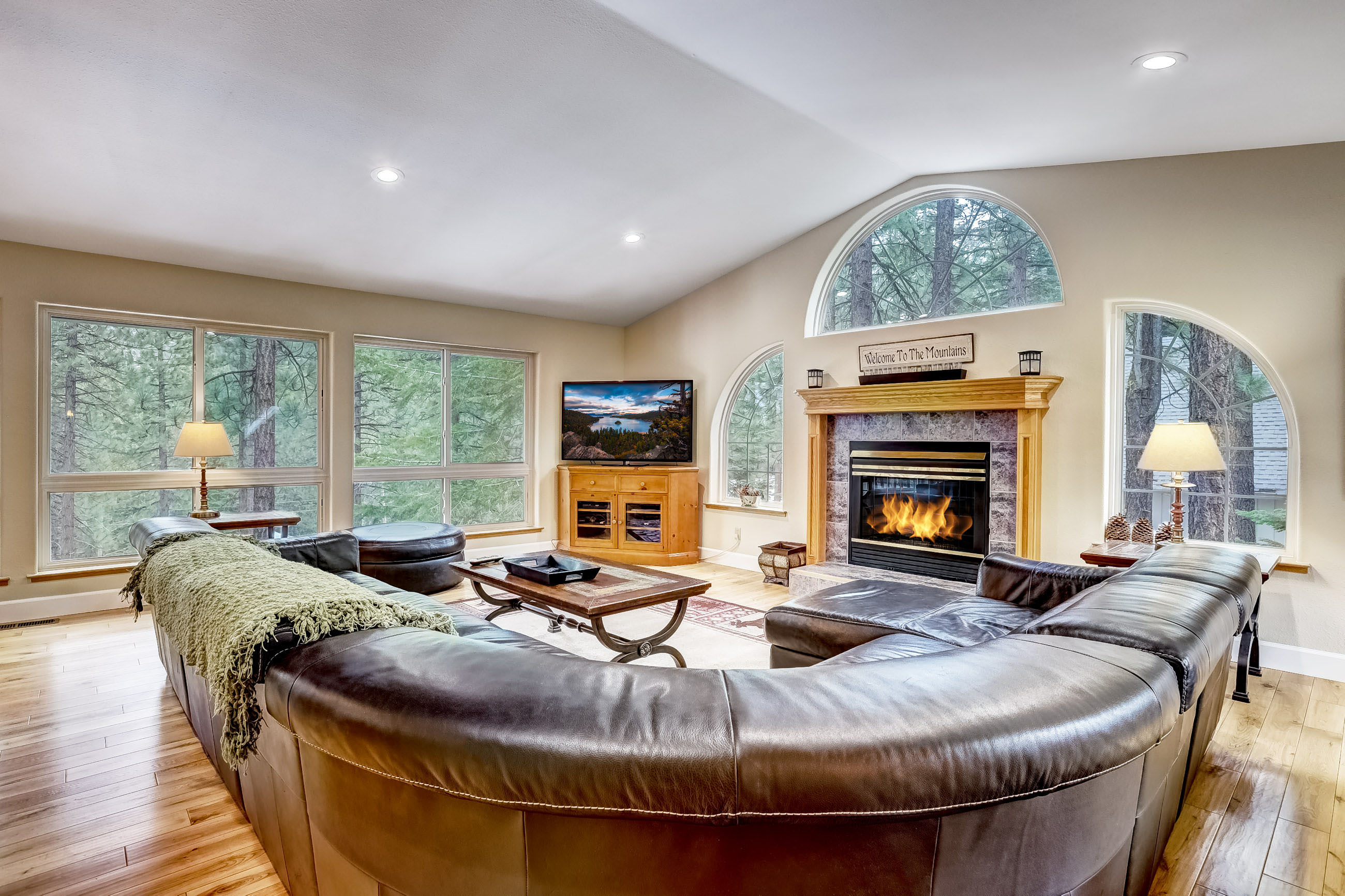 Living room w/ Smart TV, gas fireplace, foosball table