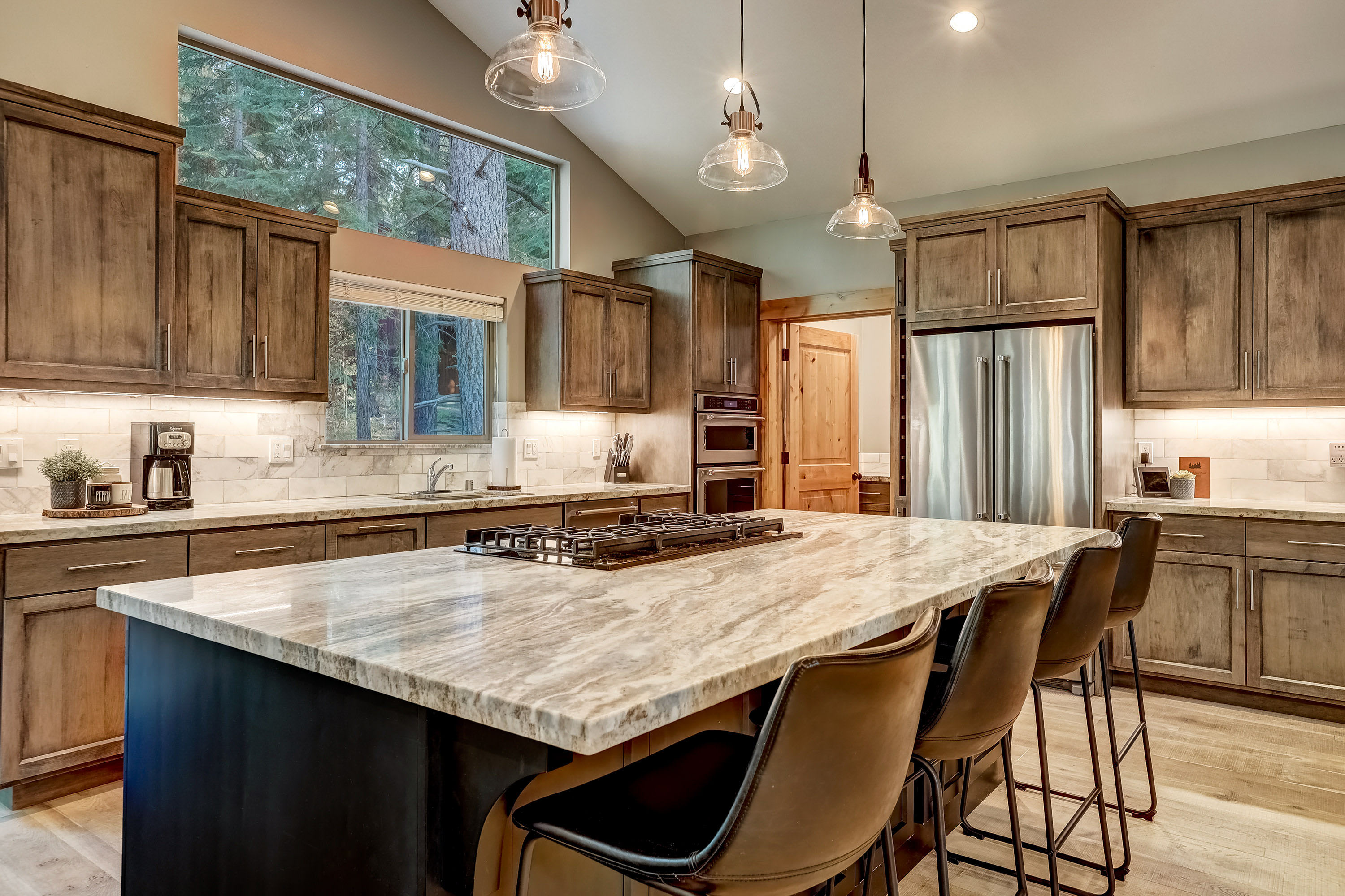 Full kitchen with drip coffee pot, double oven, dishwasher and more