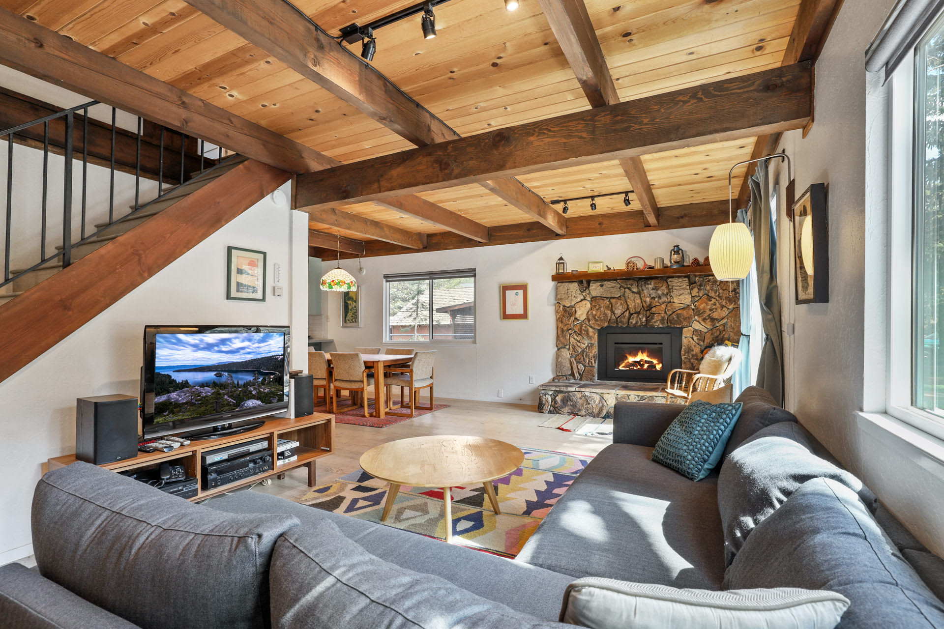 Cozy and spacious living area with TV and fireplace