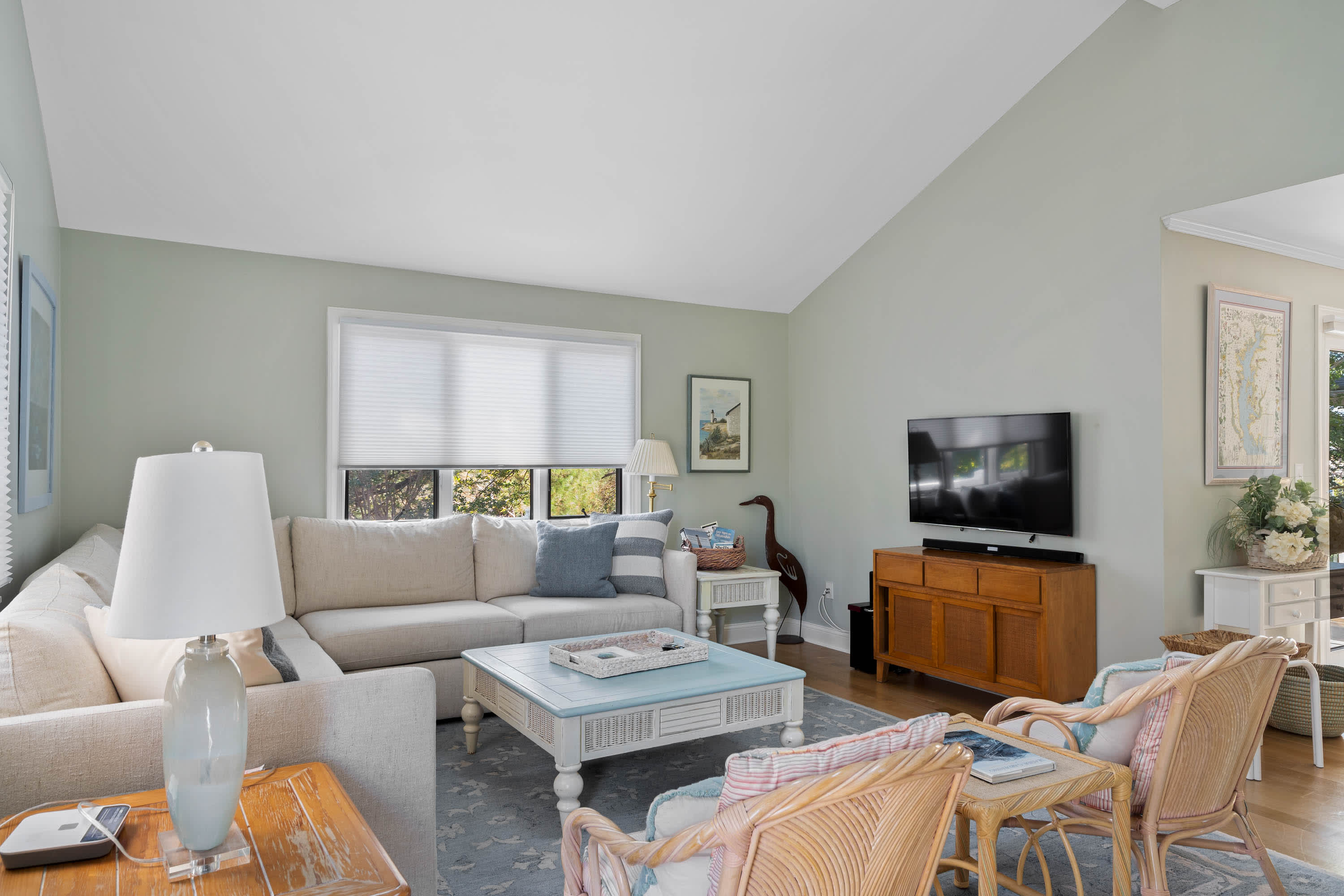 A bright and airy Living Room with comfortable seating and TV