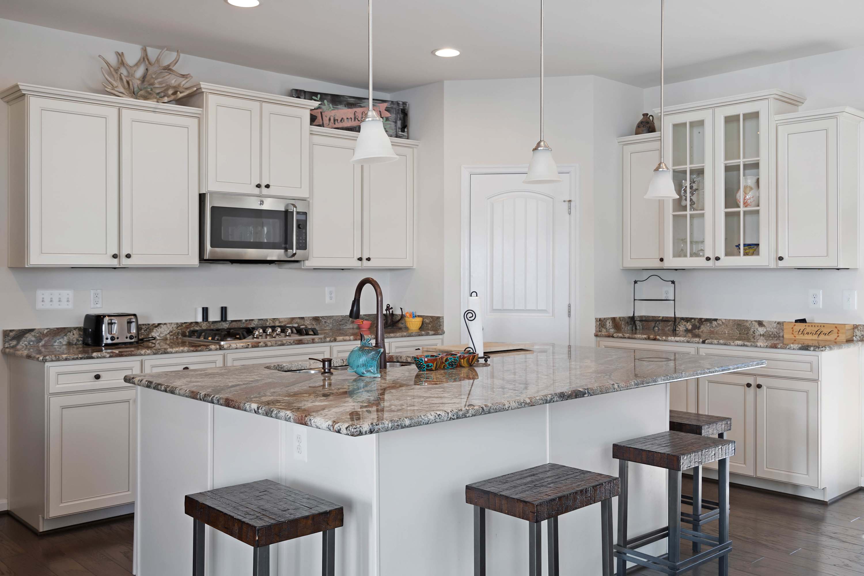 The open, airy kitchen offers ample space & all the comforts of home