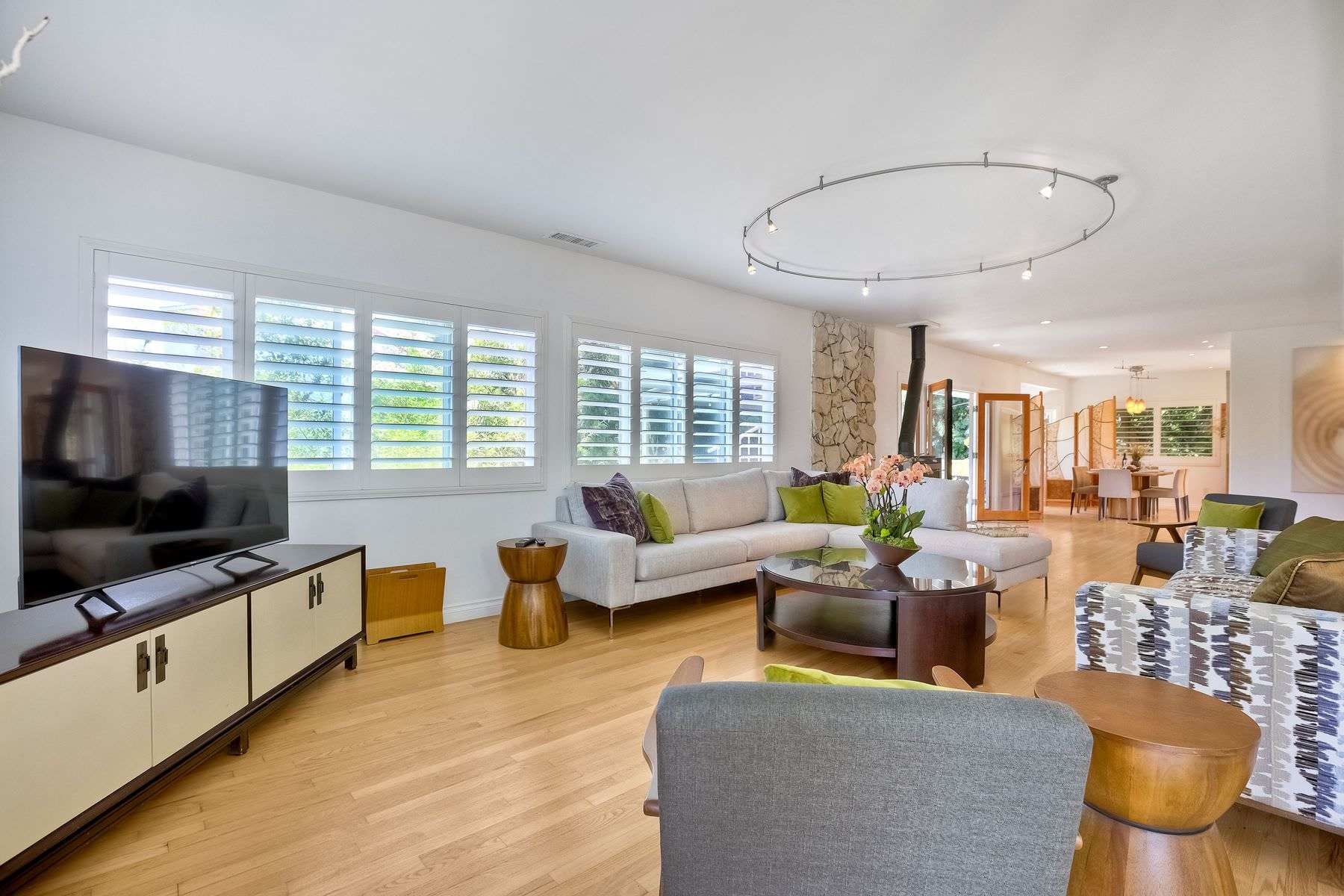 Cozy and spacious living area with TV