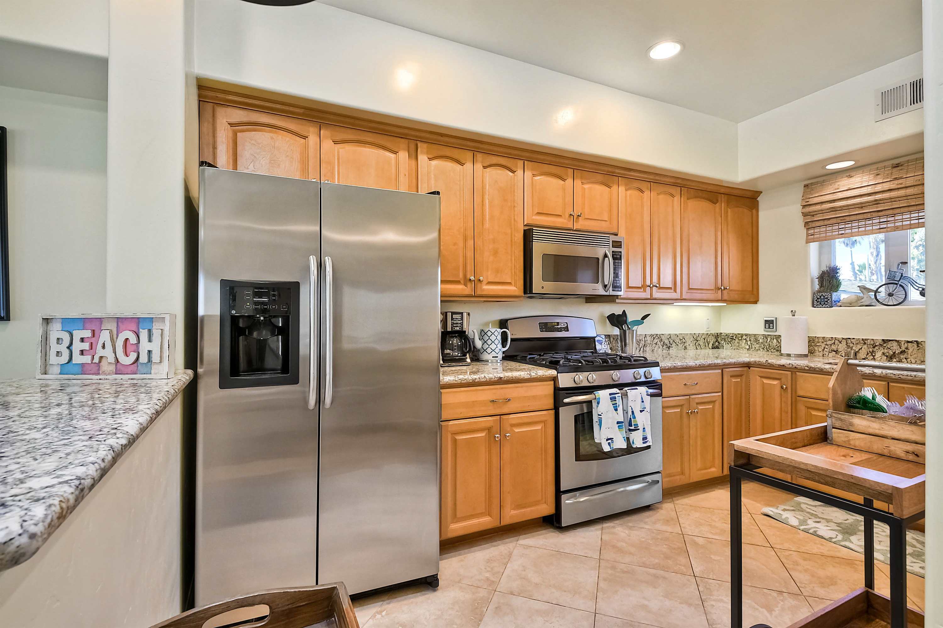 The open, airy kitchen offers ample space & every home comfort