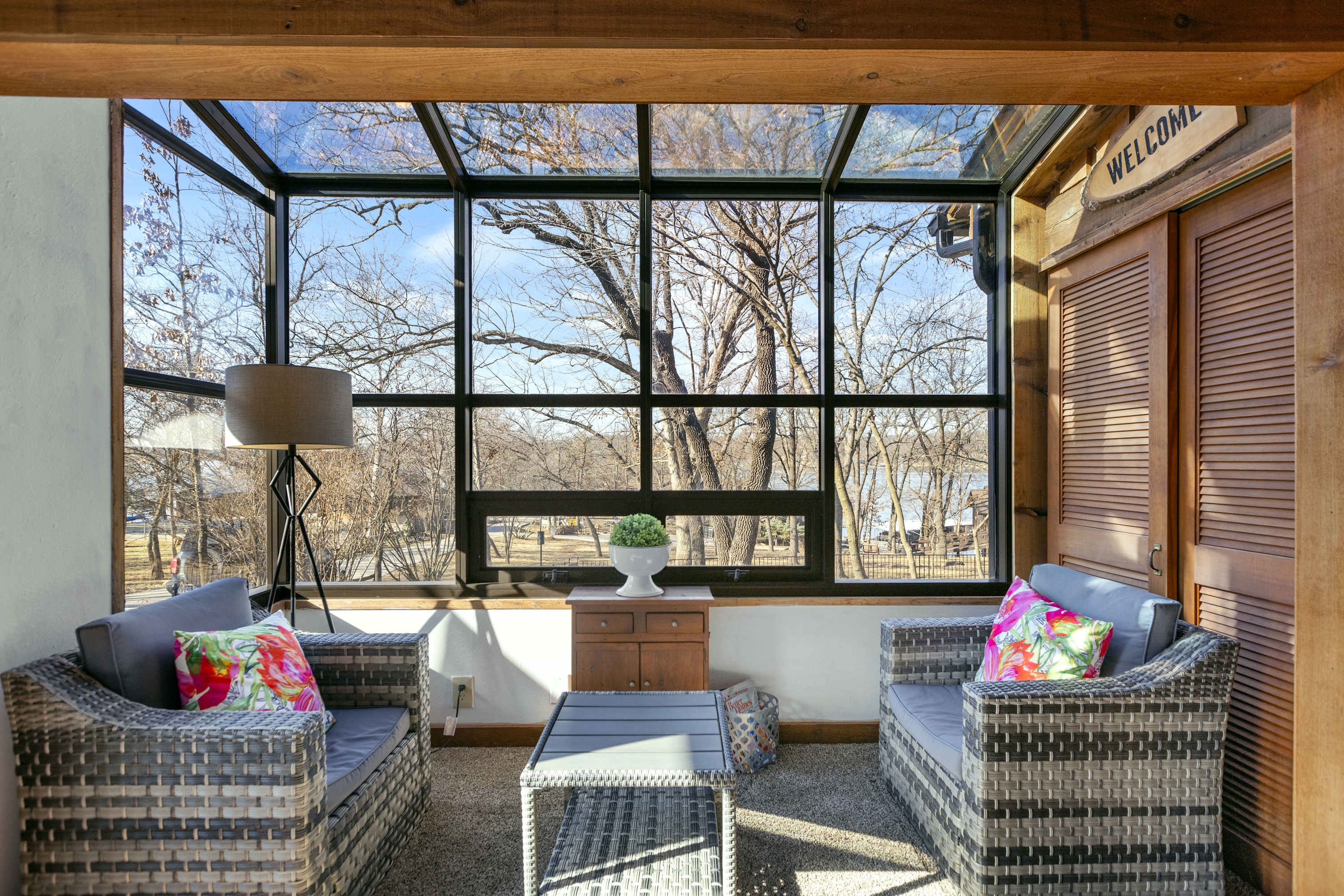 Sip morning coffee or play cards in the sunroom with stunning lake views