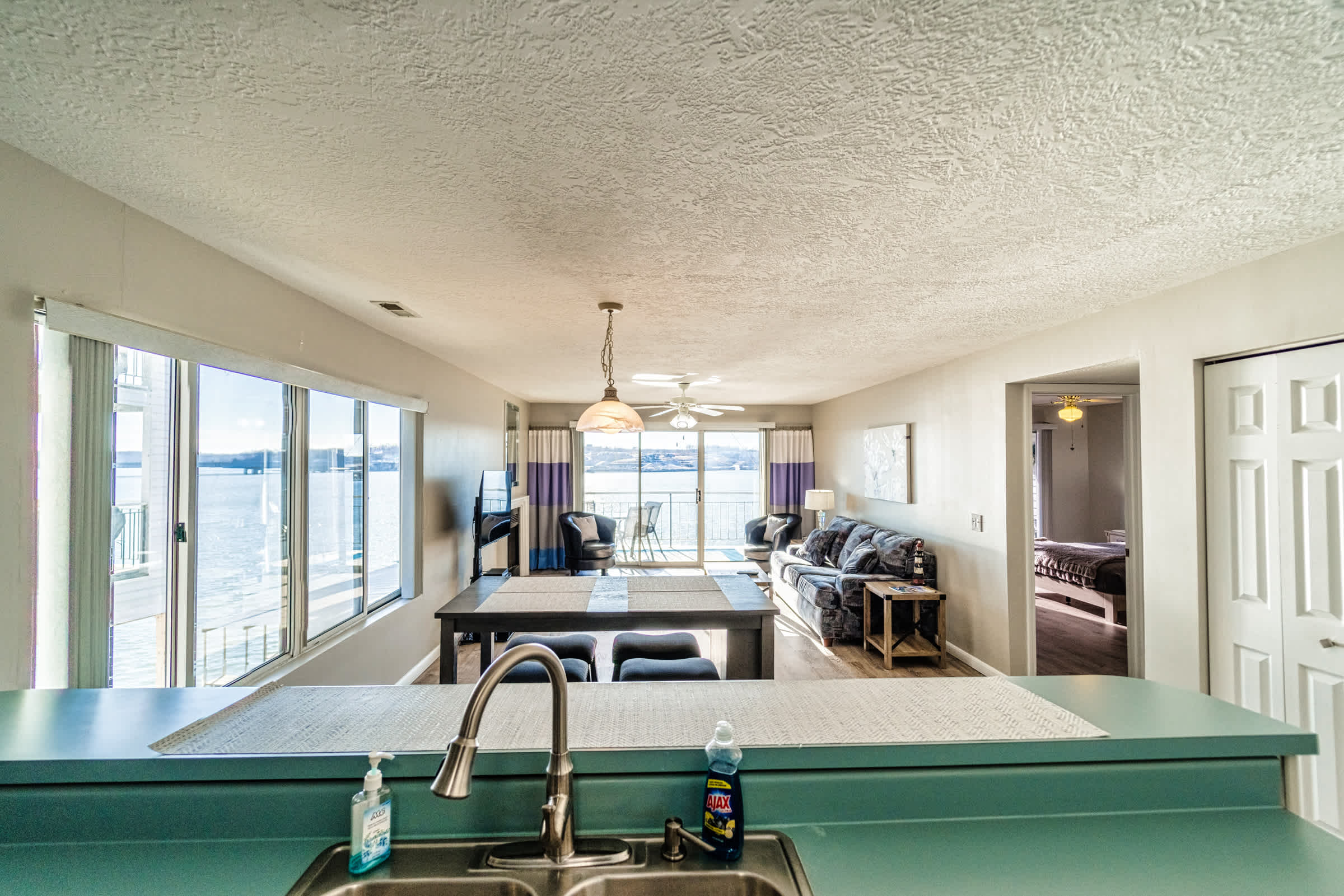 Step into an inviting, airy space with sweeping views of the lake