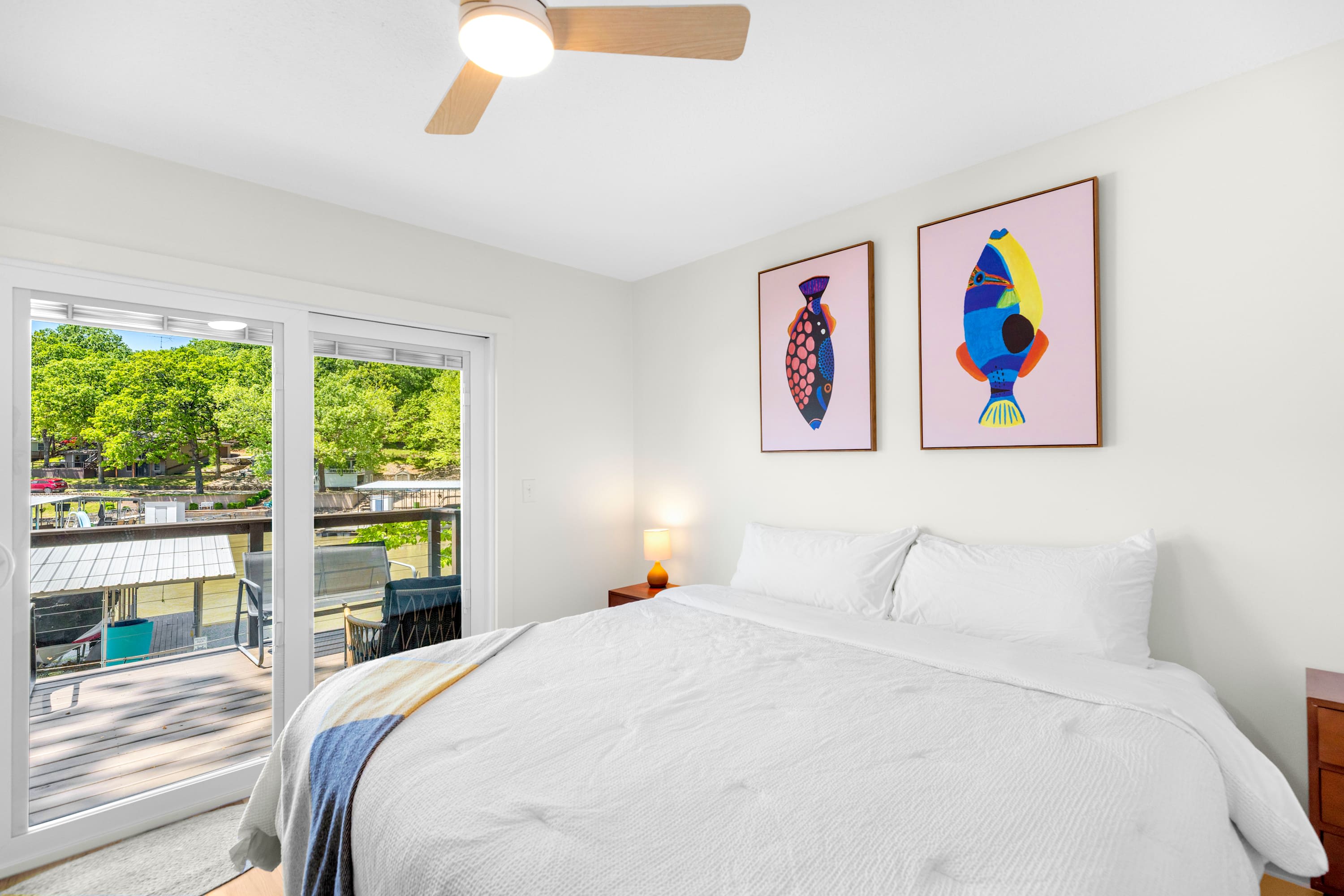 The primary bedroom includes a king bed, deck access, & Smart TV