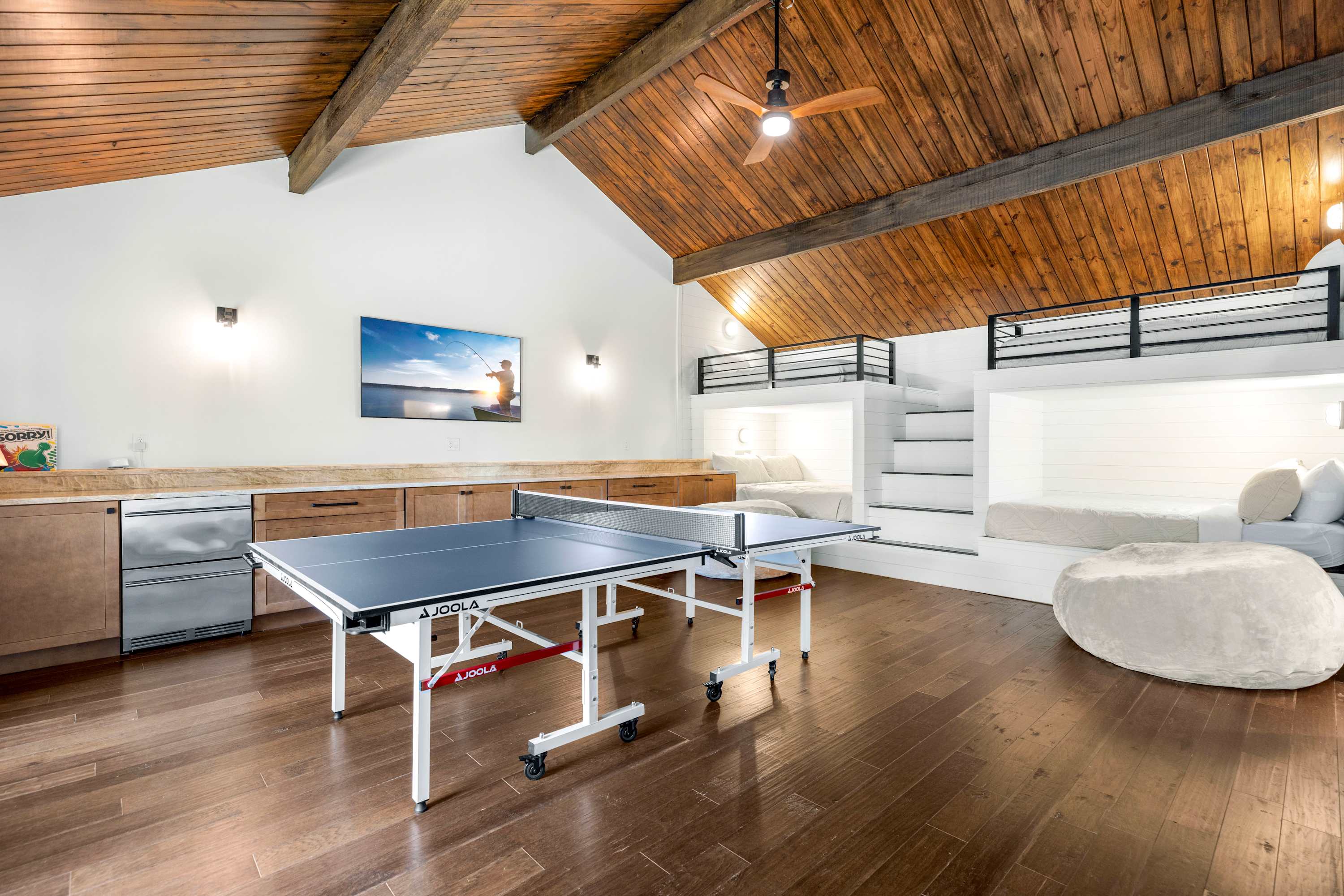 The ultimate bonus room—featuring built-in bunk beds, ping pong, a private bathroom, and laundry area. Perfect for fun, sleep, and everything in between!