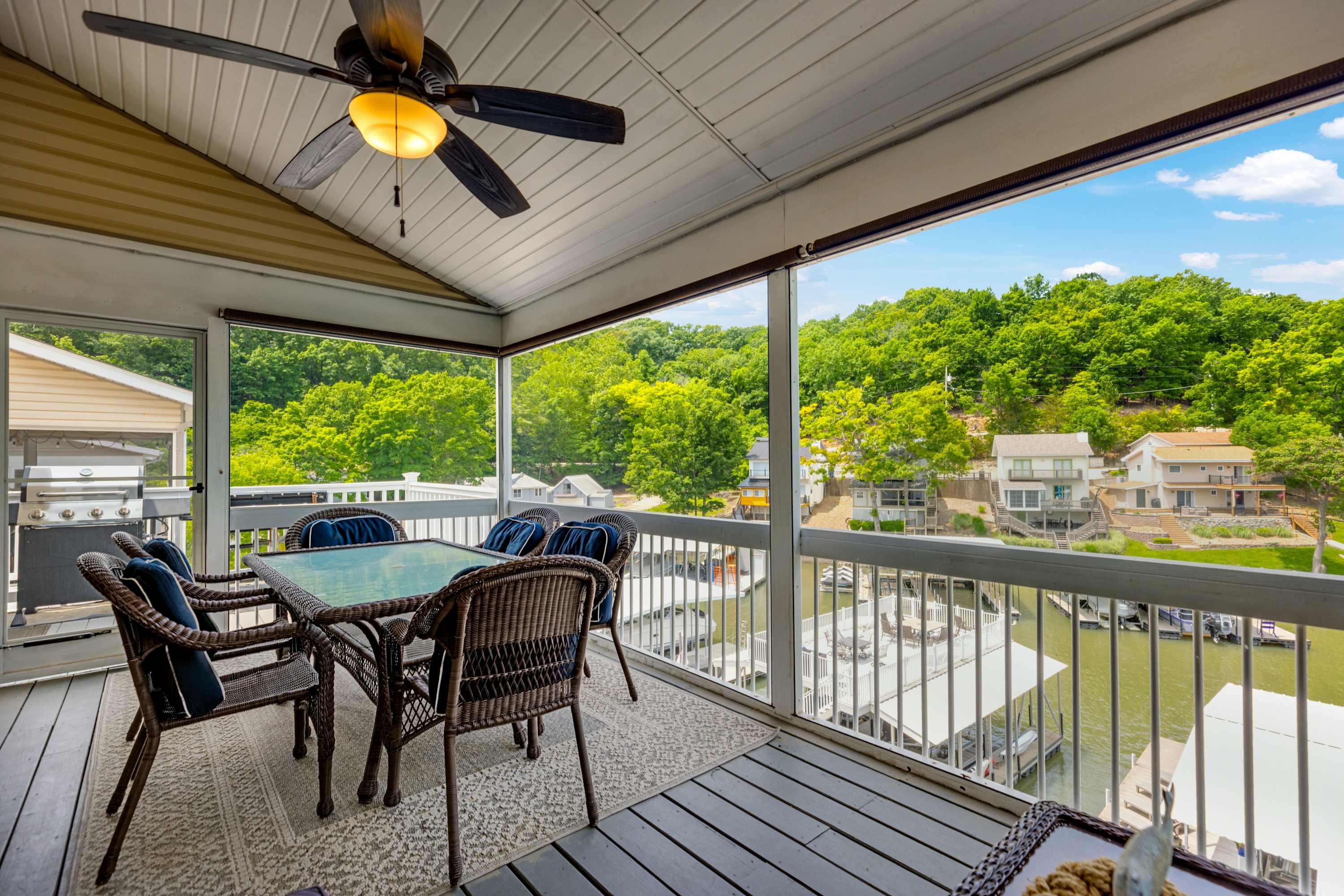 Enjoy stunning lake views from the covered deck, featuring dining for 6 and comfortable lounge seating
