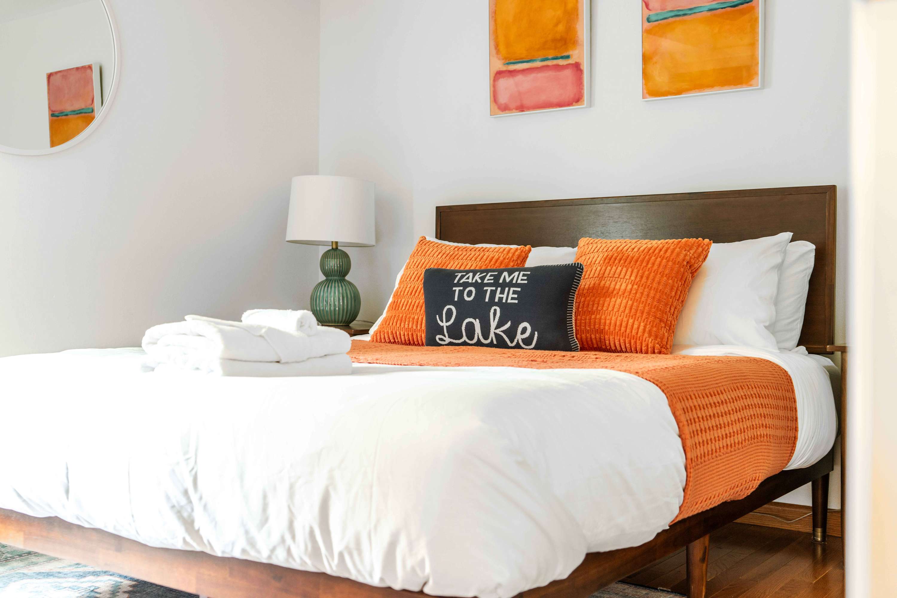 Dream of lakeside adventures in this sunshine-filled queen bedroom