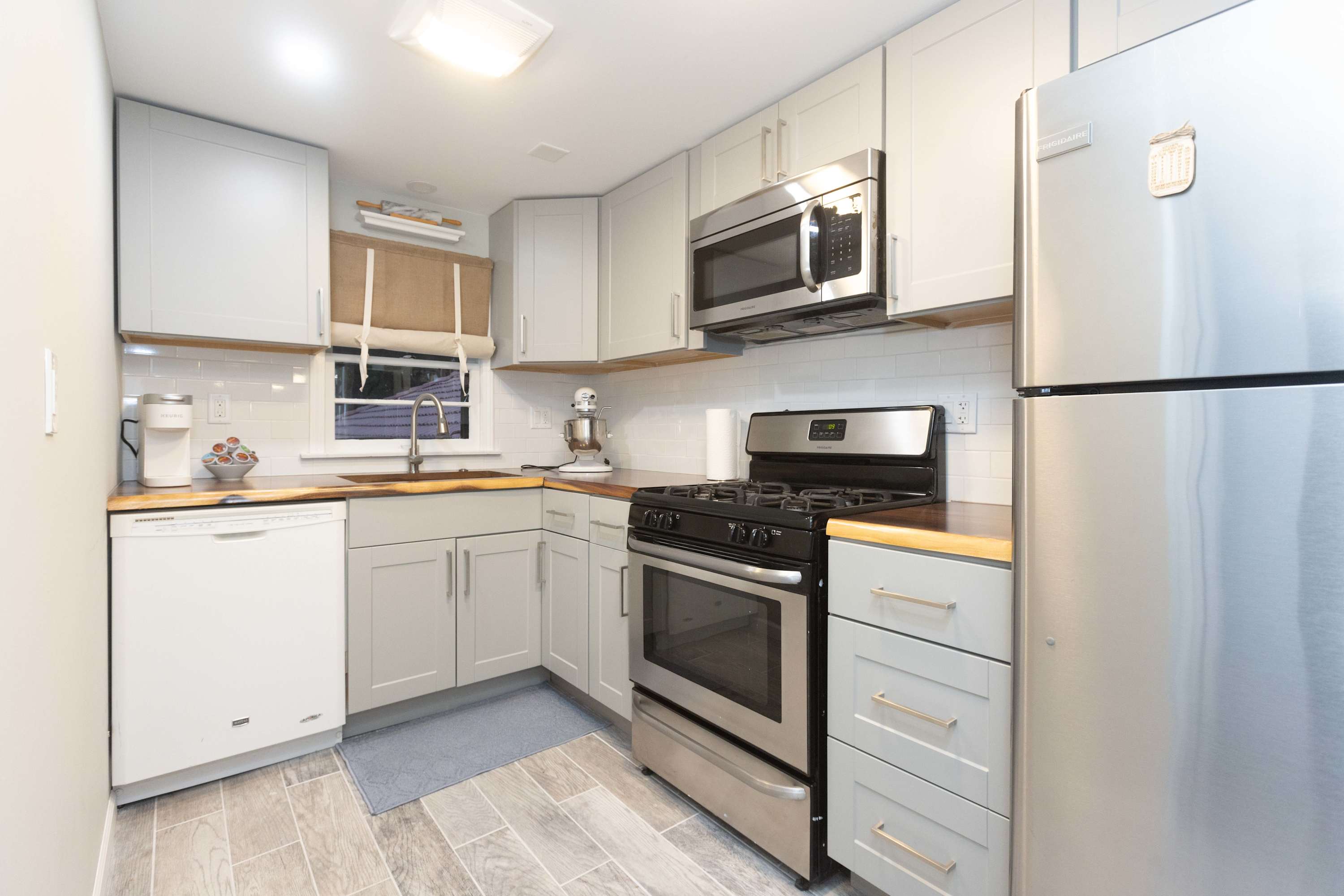 The kitchen offers ample cabinet space & all the comforts of home