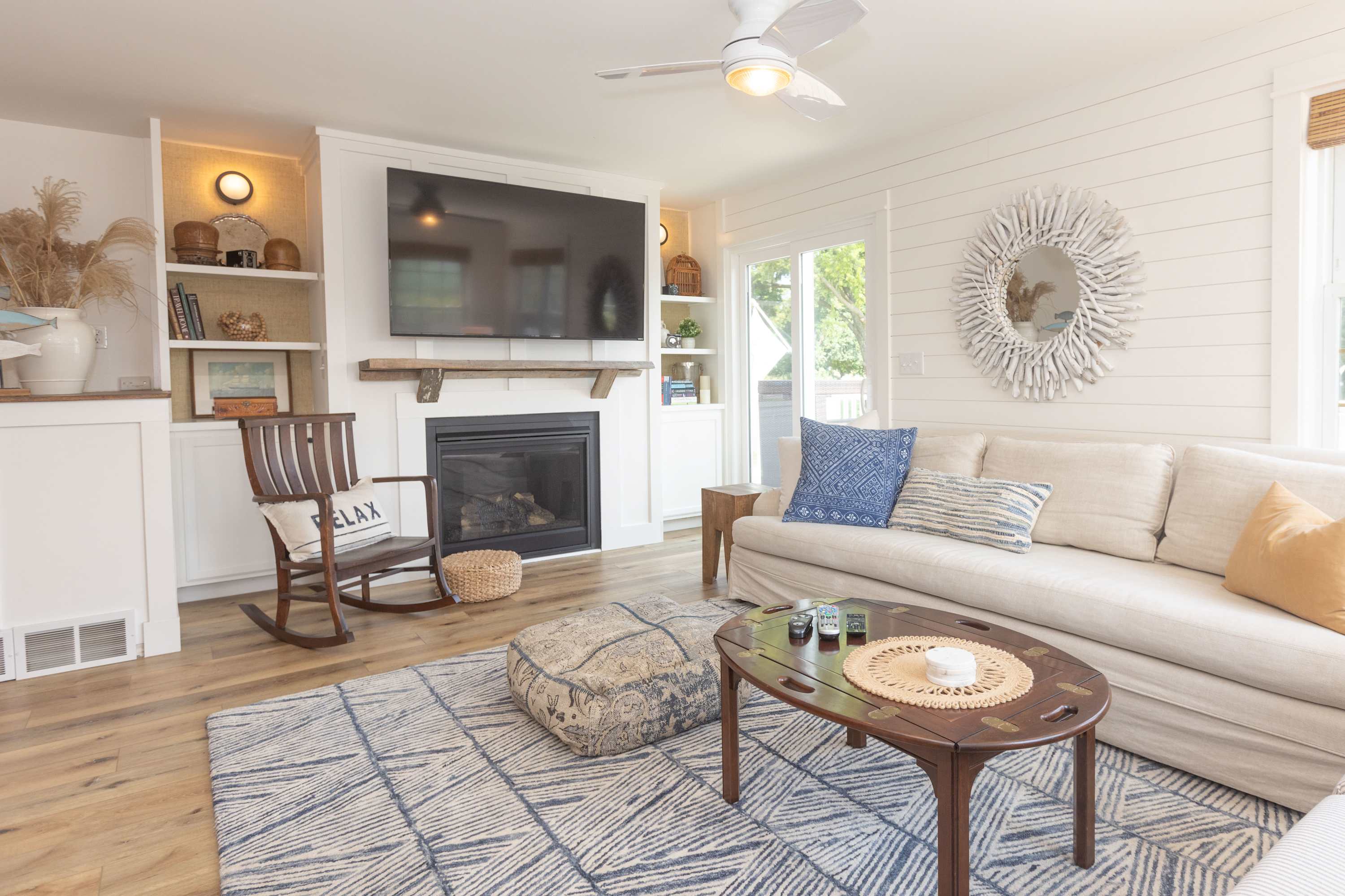 Cozy and spacious living area with TV and fireplace