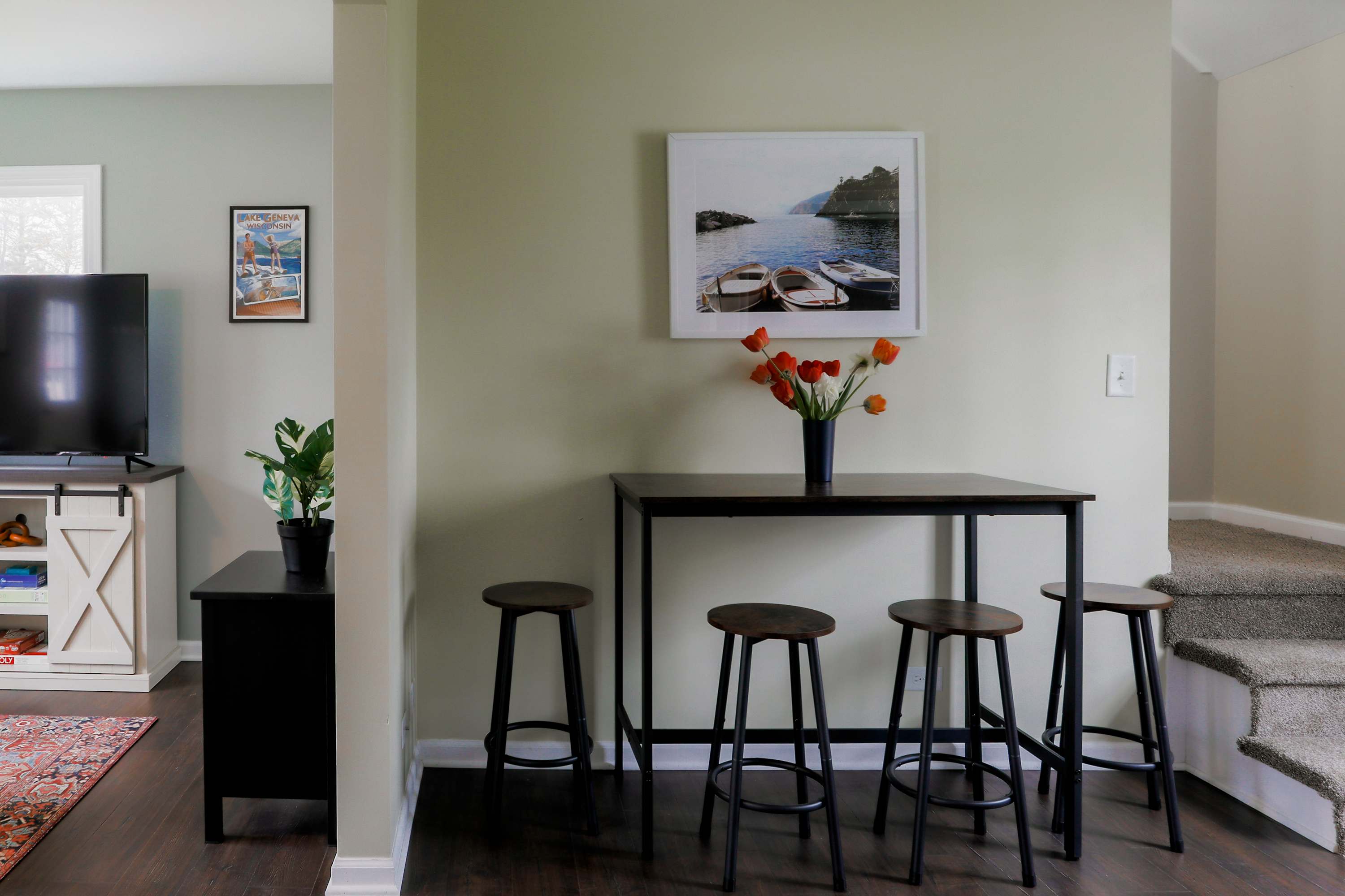 The dining table is nestled in the heart of the home & offers seating for 4