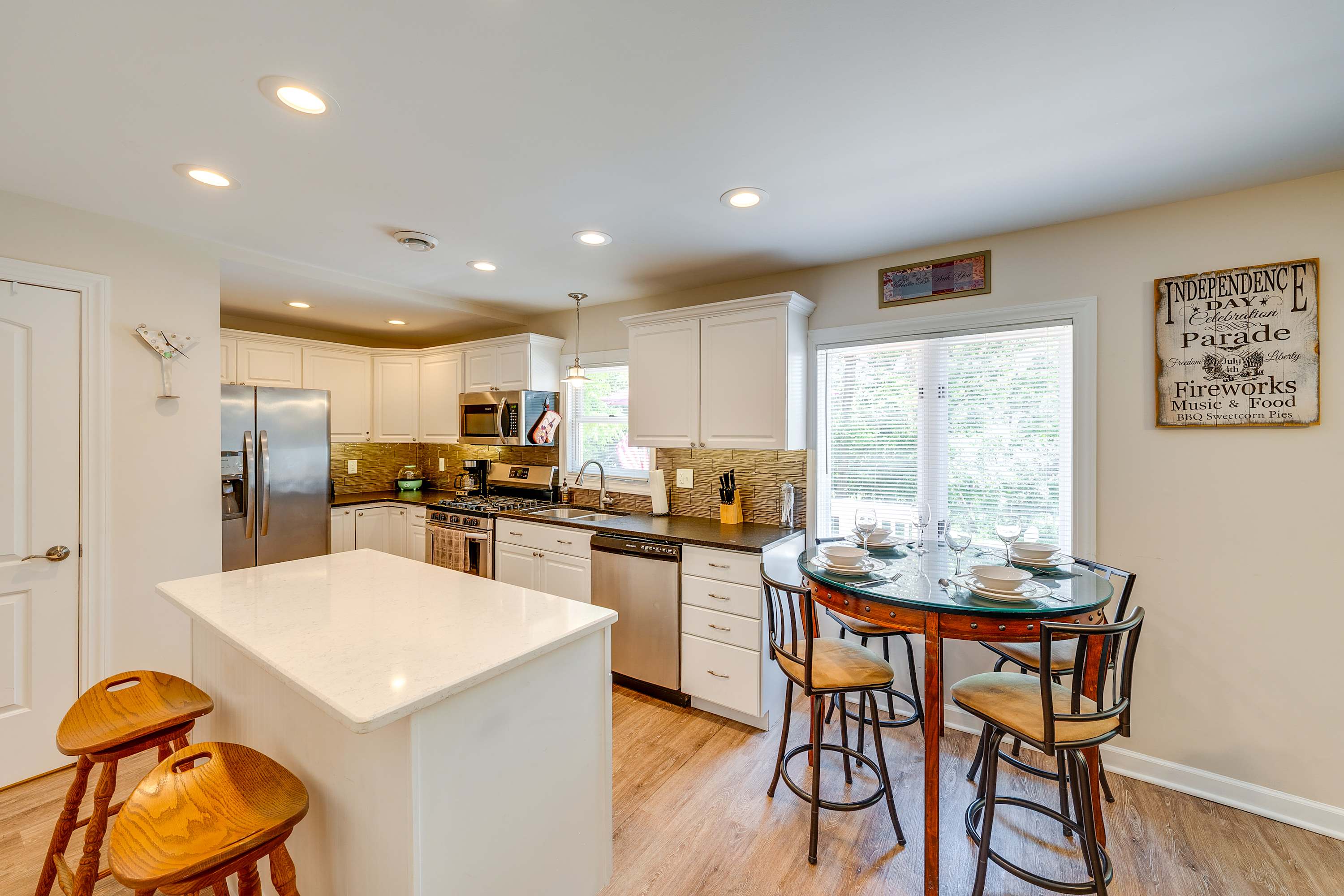 The breezy, open kitchen offers ample space & every home comfort​