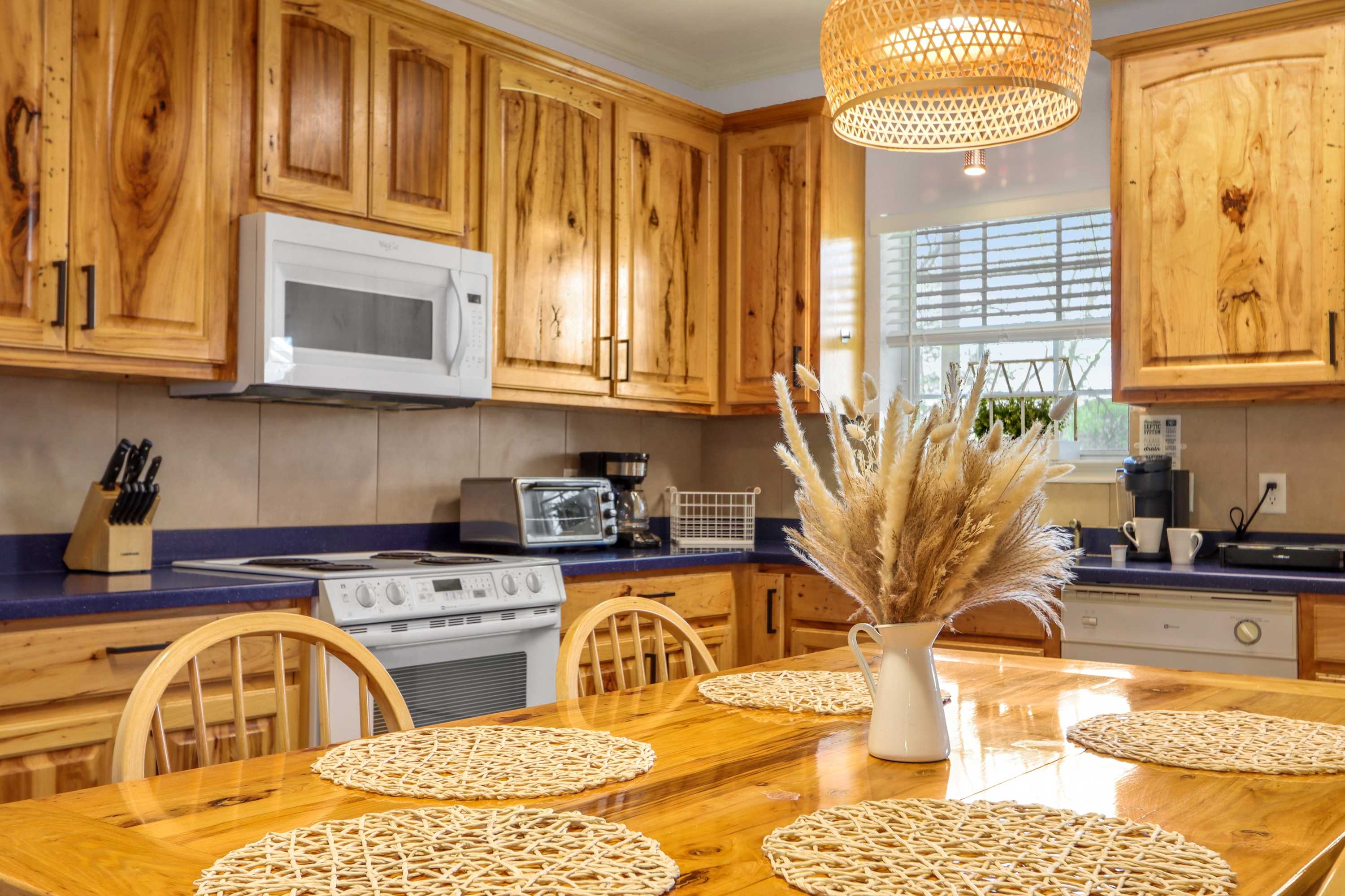 The spacious eat-in kitchen is well equipped for your visit to New Braunfels