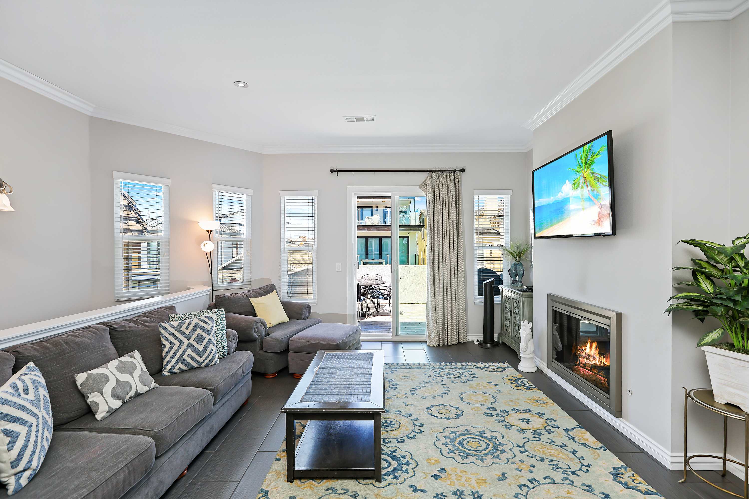 Curl up in the breezy living room & enjoy a fireside movie night at home!