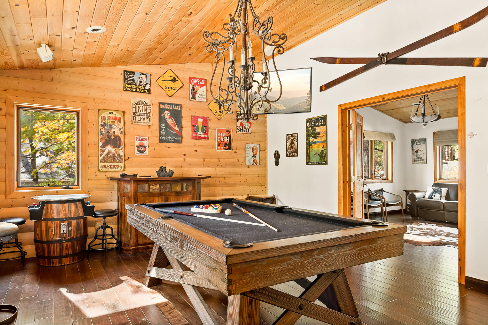 Game room with pool table, arcade game, and electric dart board