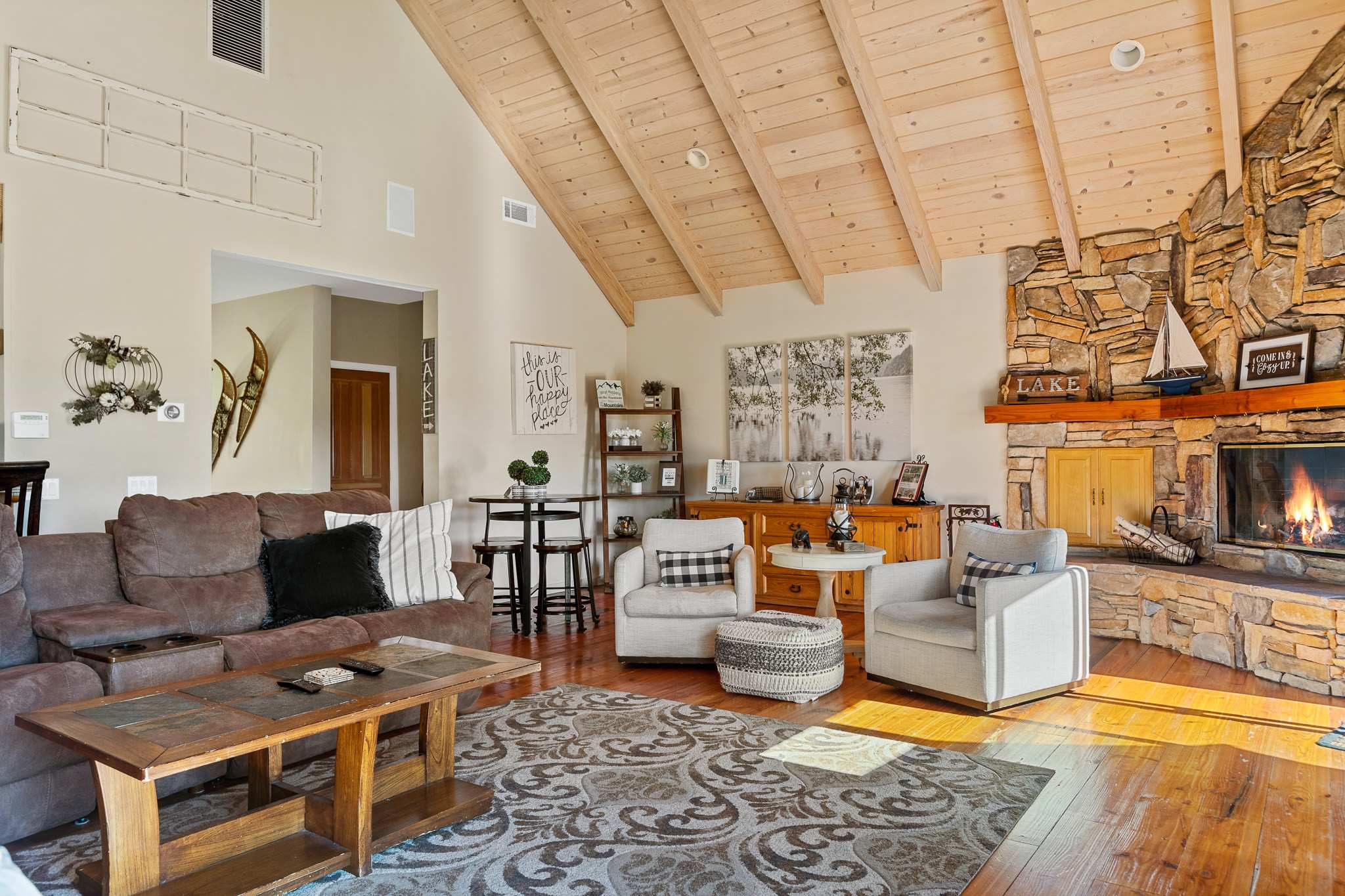 Spacious open floor plan with soaring peak ceiling.