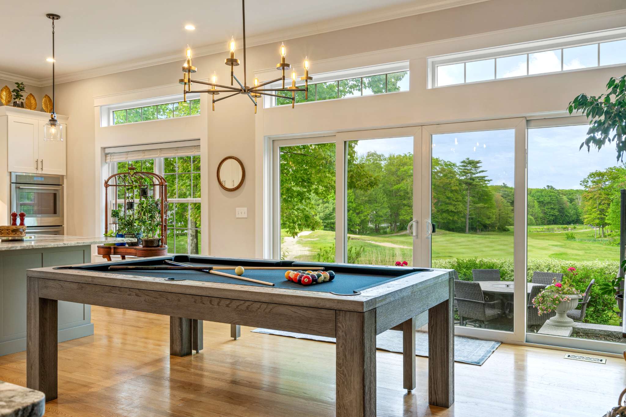 Bright dining area with a table that converts into a pool table, seating up to 8