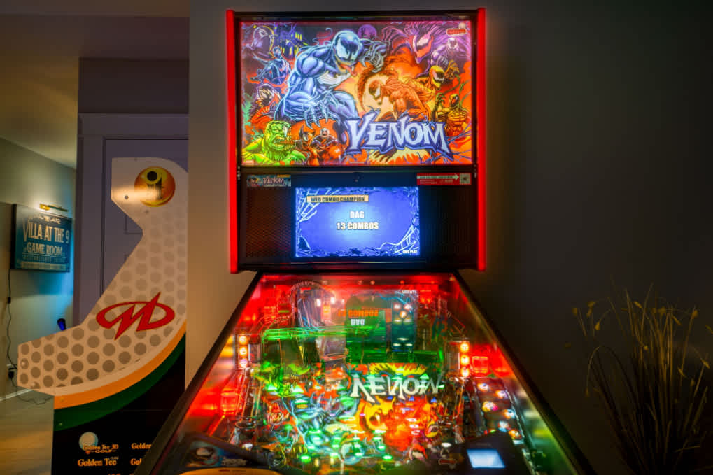 Game room with bunk bed, 6 commercial-grade arcade games, wet bar, and Xbox