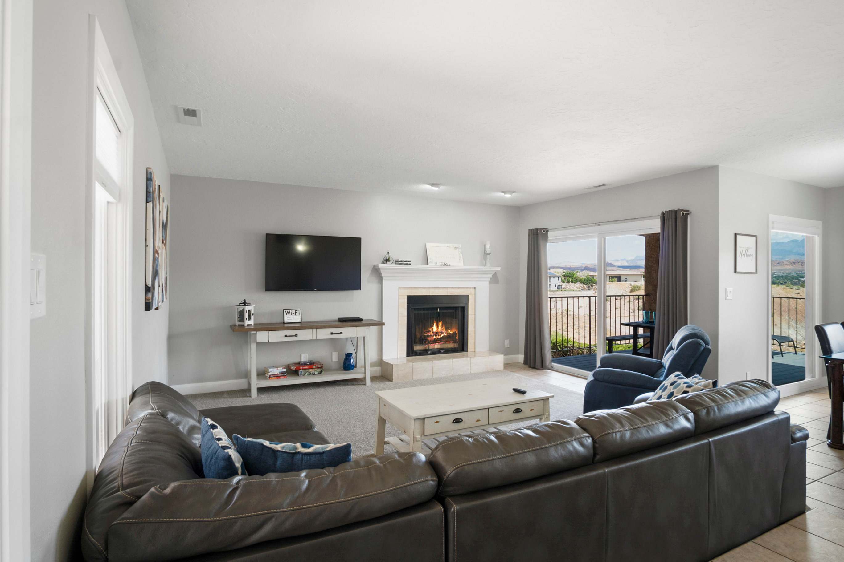 Cozy and spacious living area with TV and fireplace