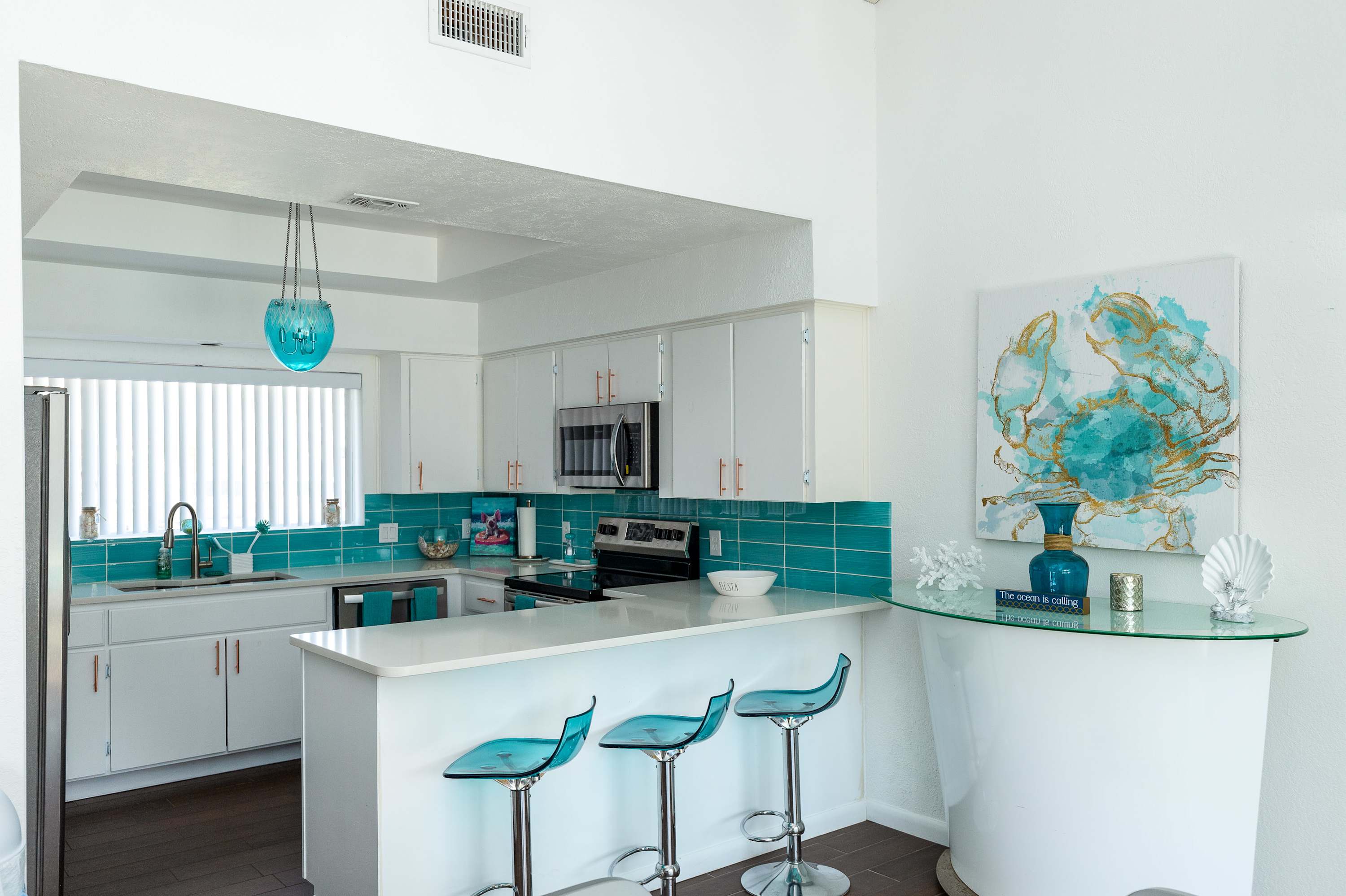 Sip morning coffee or enjoy a snack at the kitchen counter, with seating for 3