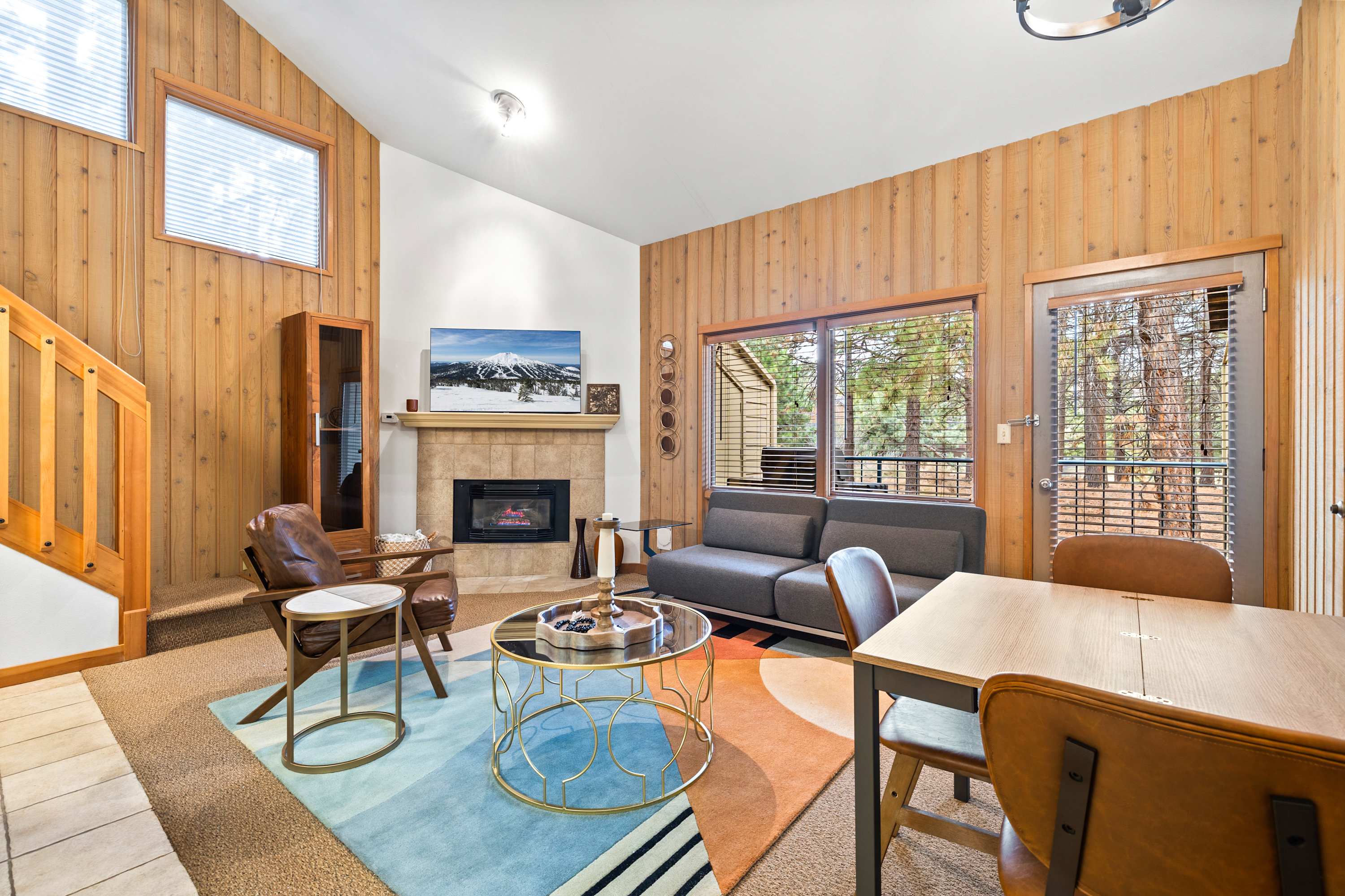 Spacious open living space with sofa sleeper and gas fireplace