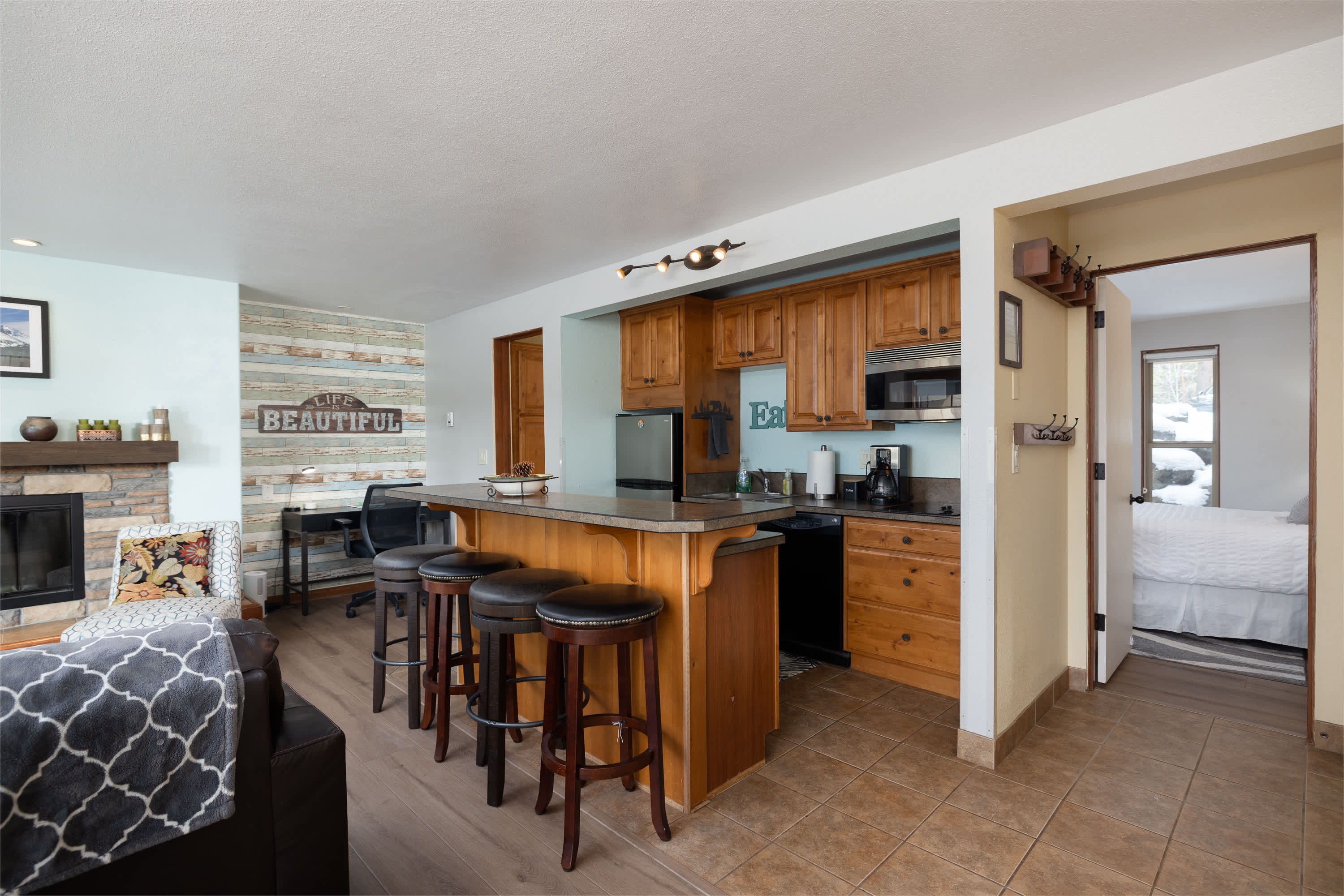 The inviting open kitchen offers ample space & all the comforts of home