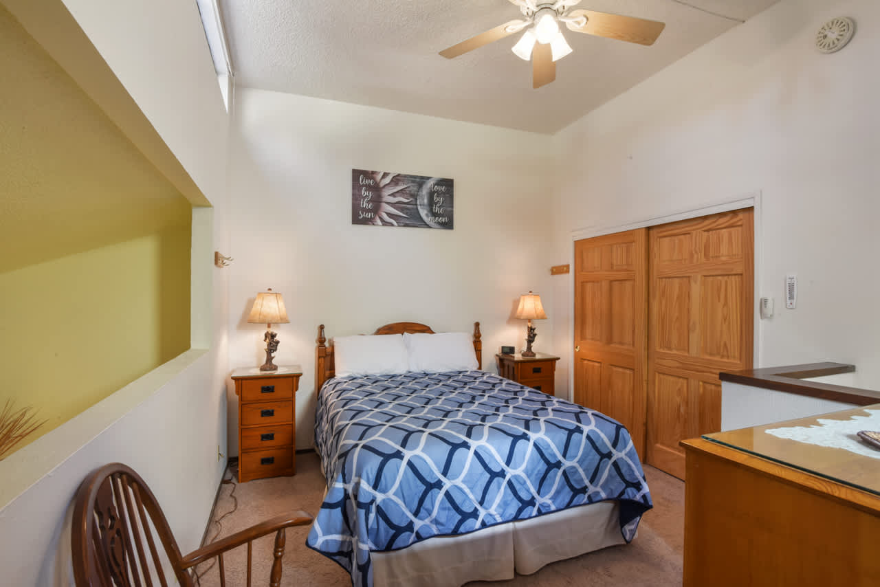 Relax and unwind in the cozy queen bed in this loft