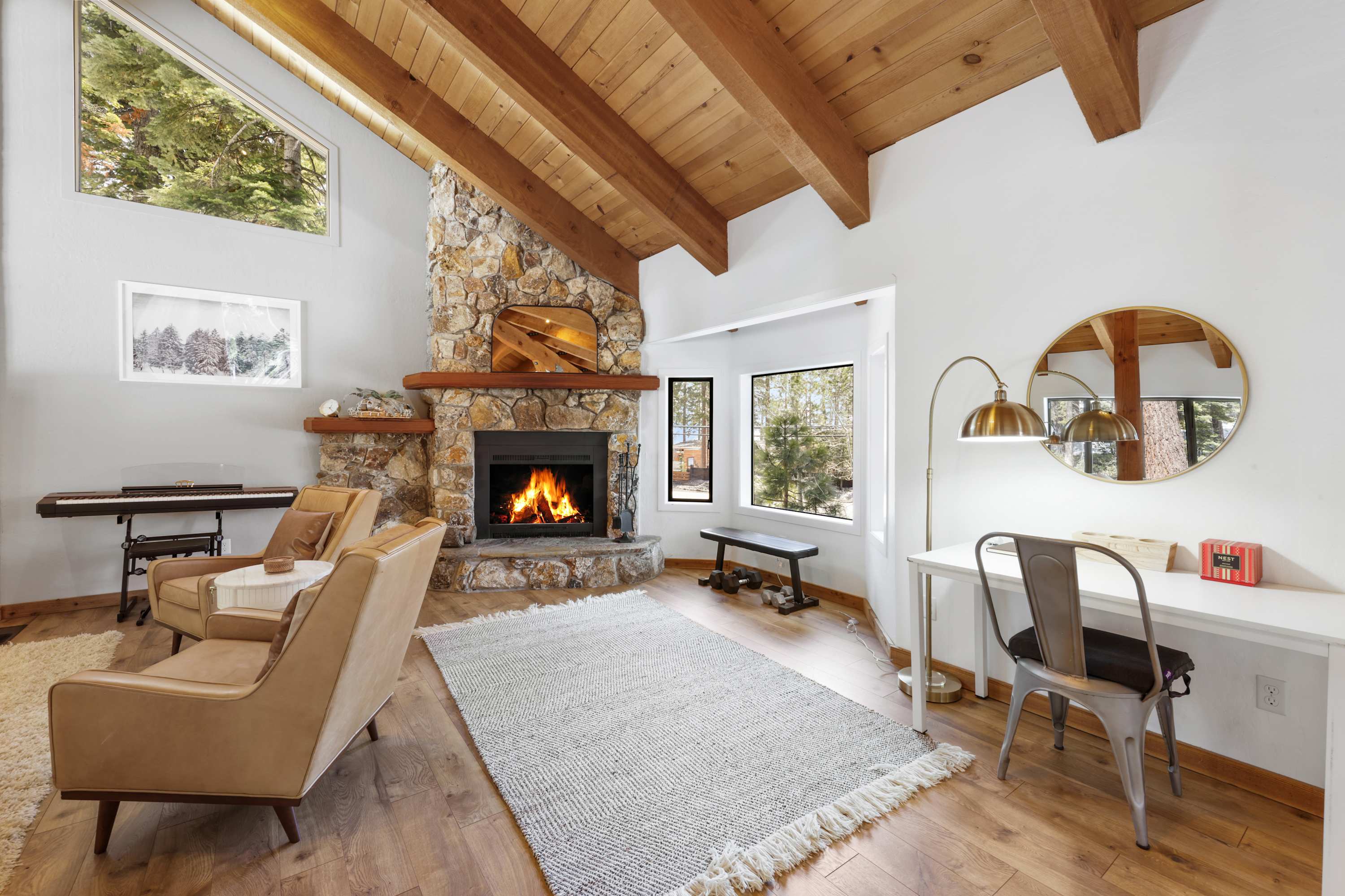 Cozy and spacious living area with TV and fireplace