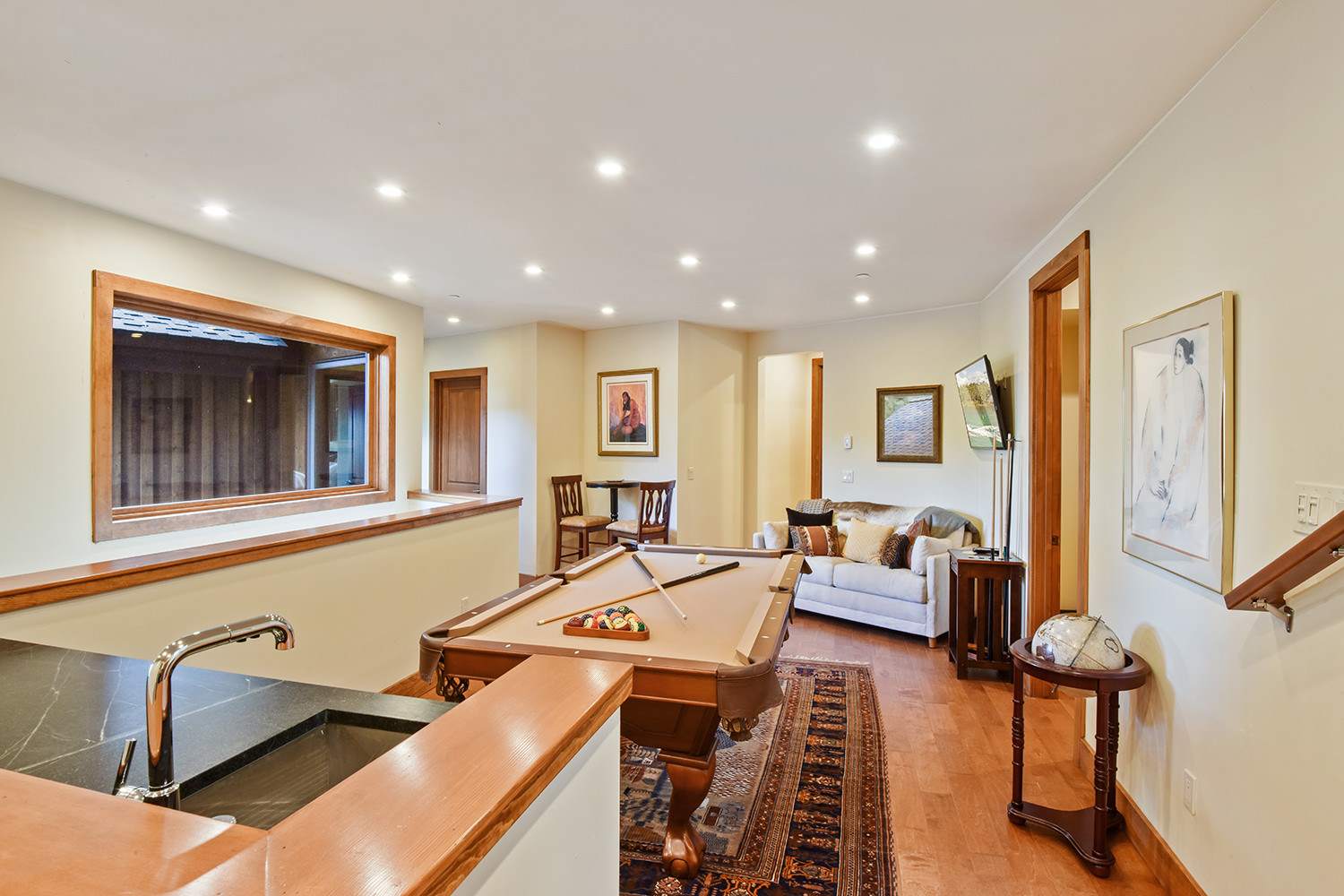 2nd floor game room with pool table, smart Samsung TV, and bar