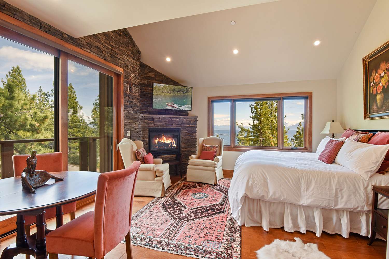 3rd floor master bedroom: King bed with lake view, Smart TV, private balcony and gas fireplace