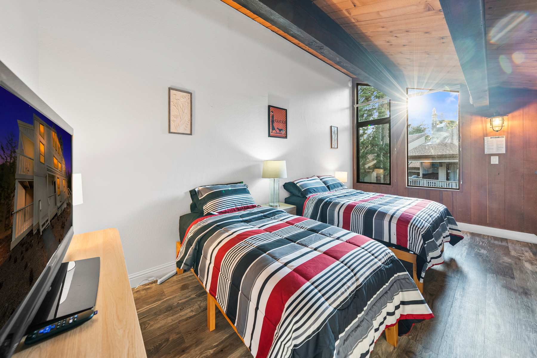 Loft area equipped with a full and twin bed, plus a TV 