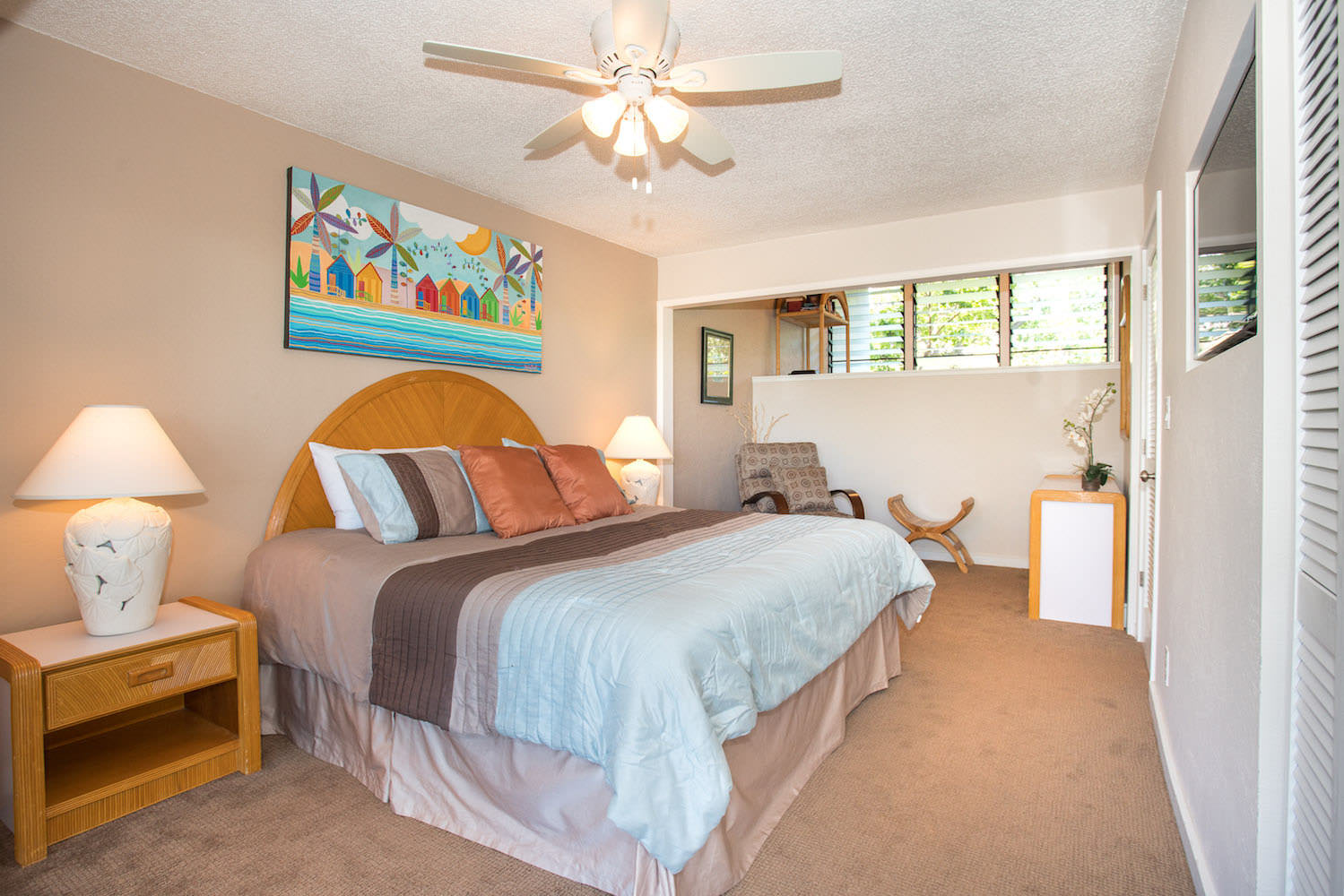 Master bedroom w/ TV and balcony access