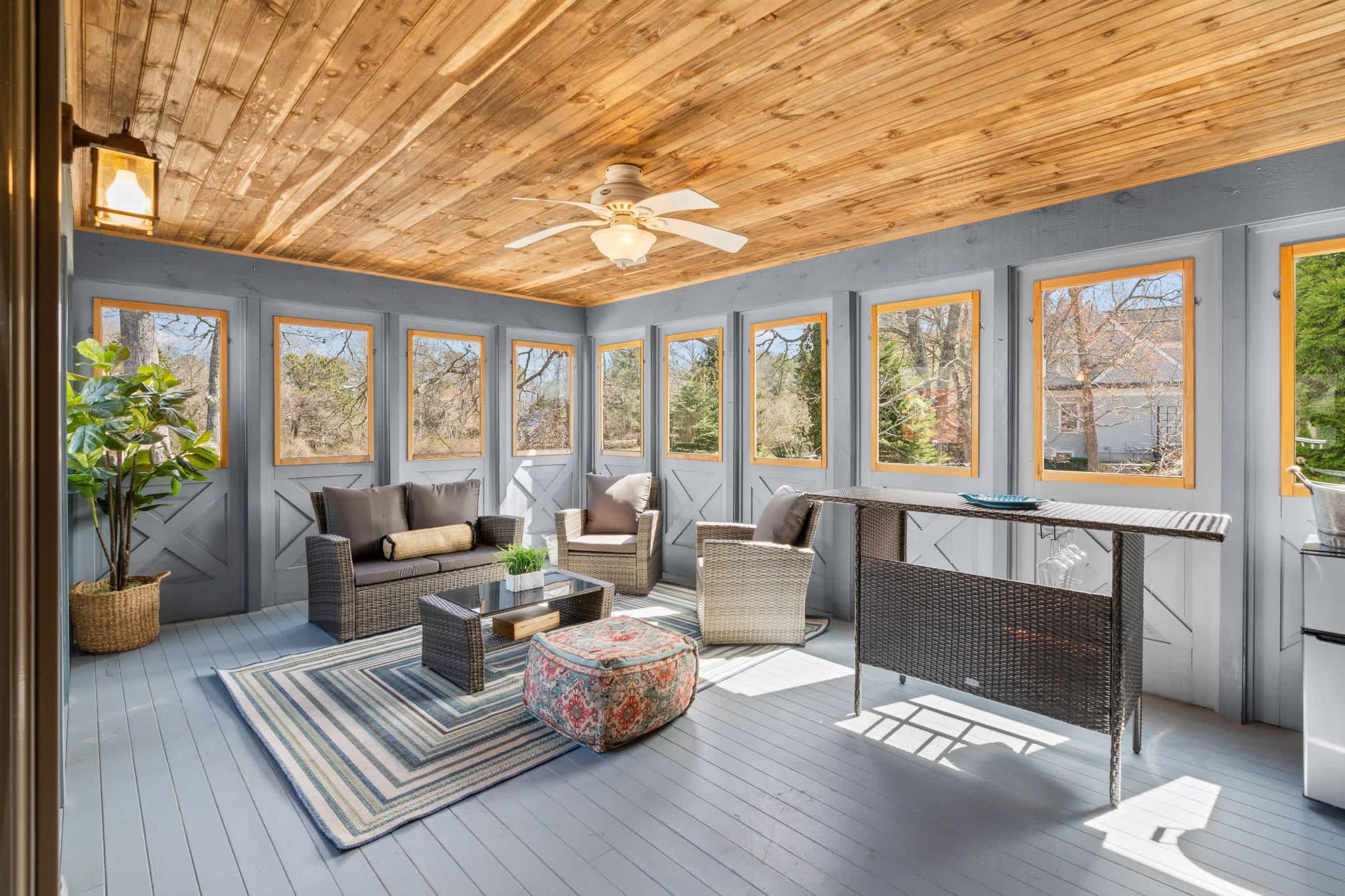 Sip morning coffee or an evening cocktail in the cozy sunroom