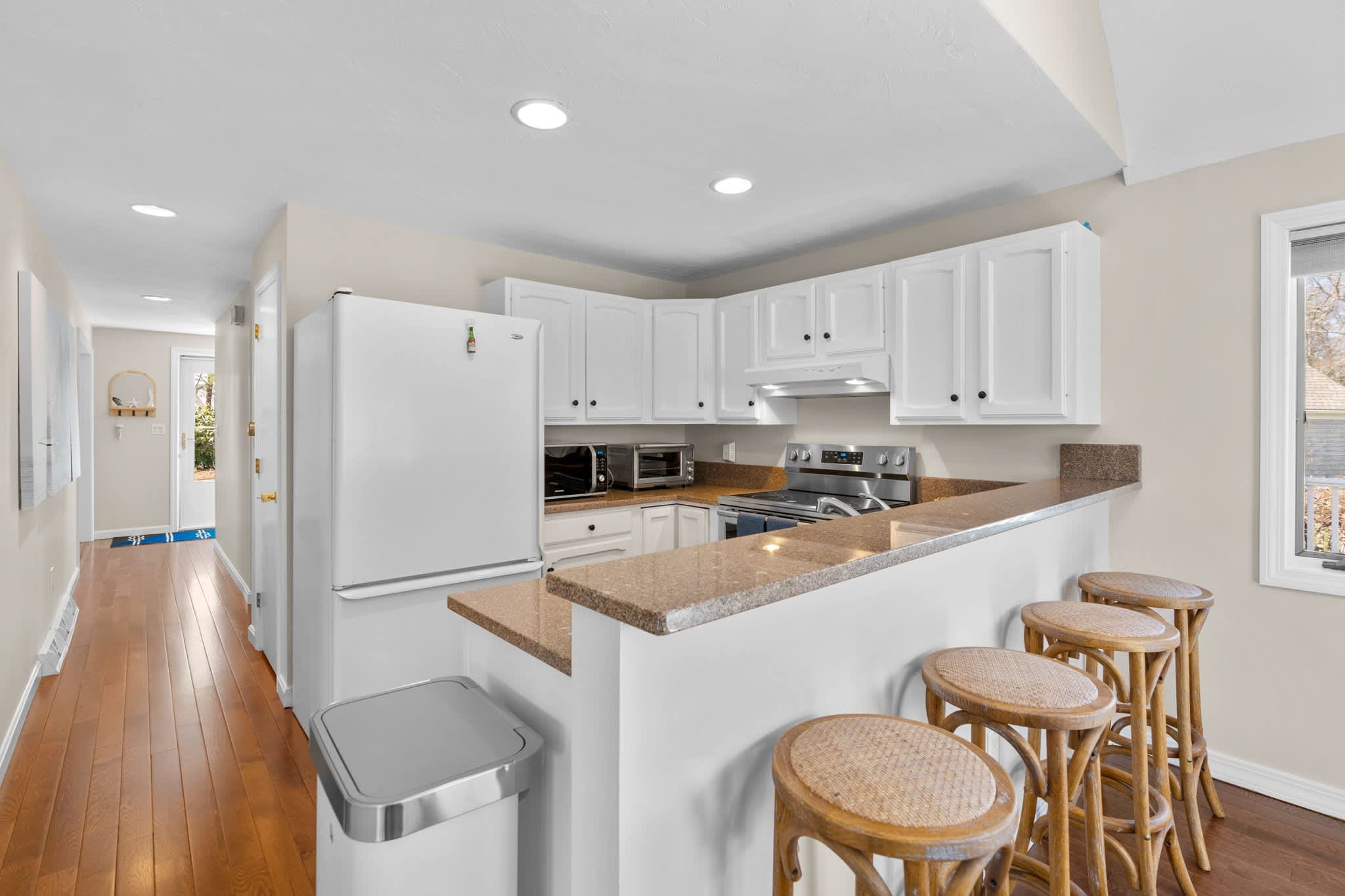 The open, airy kitchen offers ample space & every home comfort