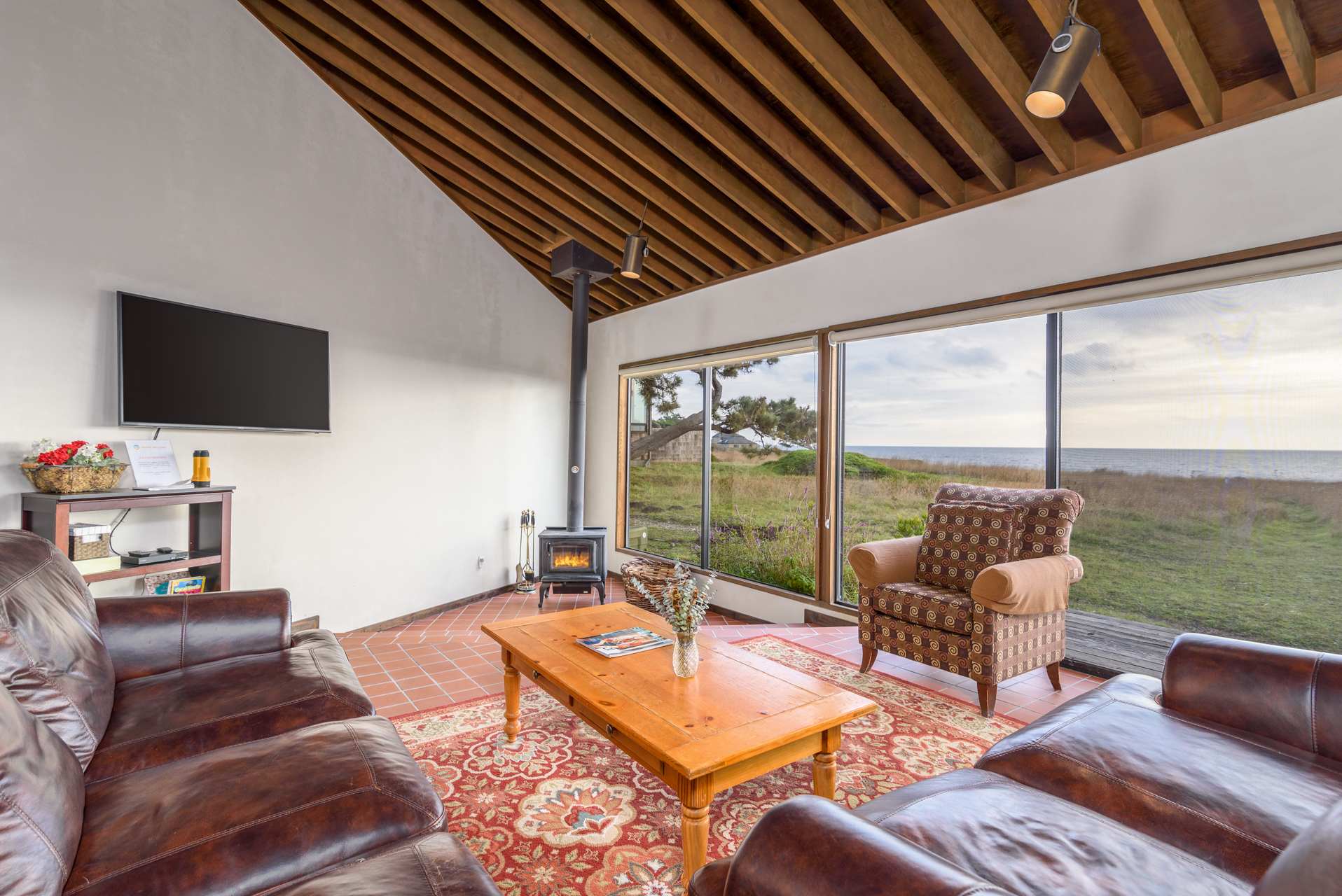 Cozy and spacious living area with TV