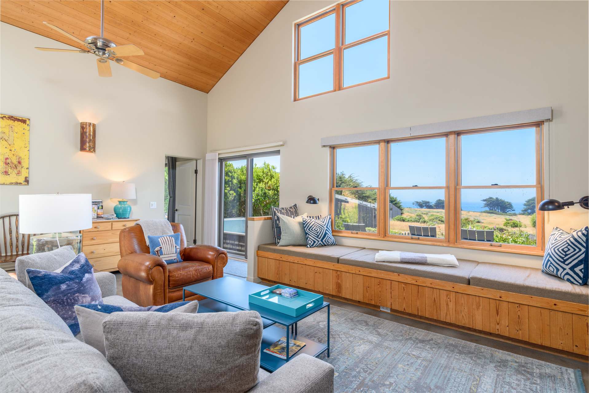 Unwind with comfortable seating, and large windows offering a stunning view of the ocean