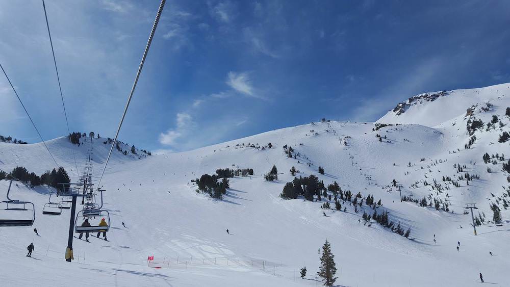 Snow covered mountain and ski lift