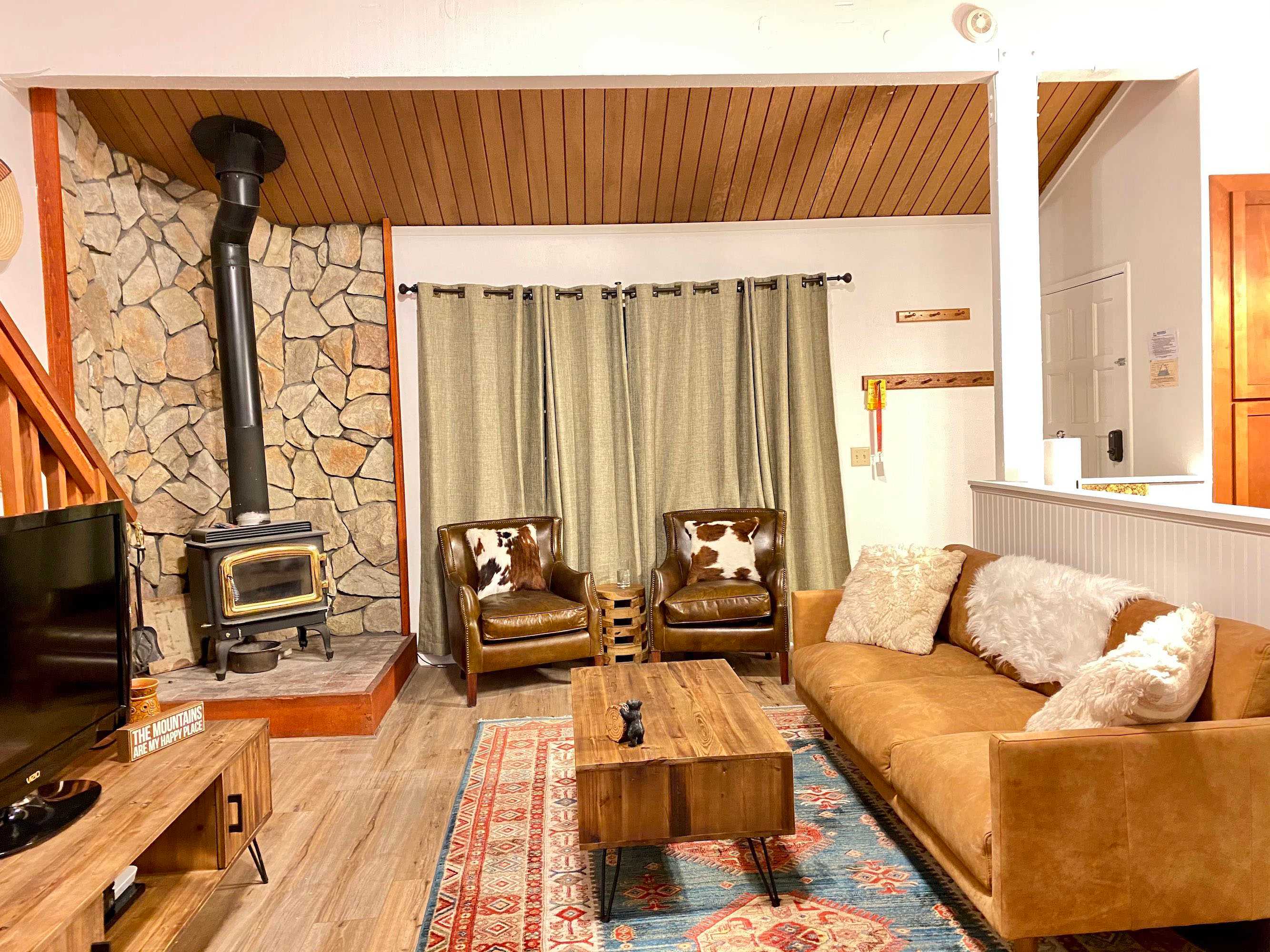 Living room with Apple TV, DVD player, fireplace