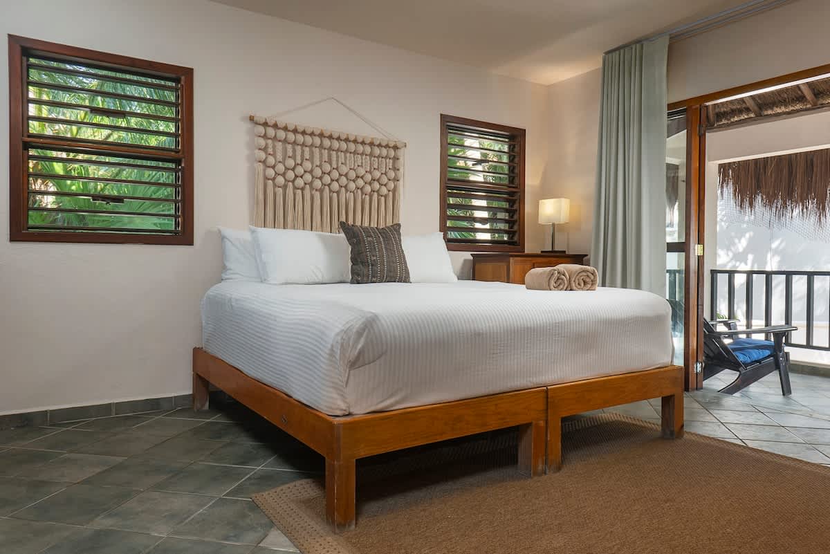 Bedroom 1 with a king-size bed and terrace.