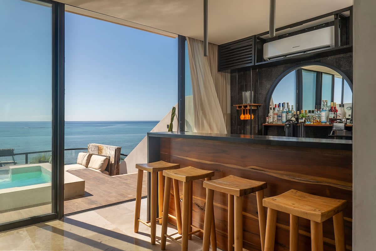 A mini bar with stunning ocean views, complemented by a beautiful and private terrace view
