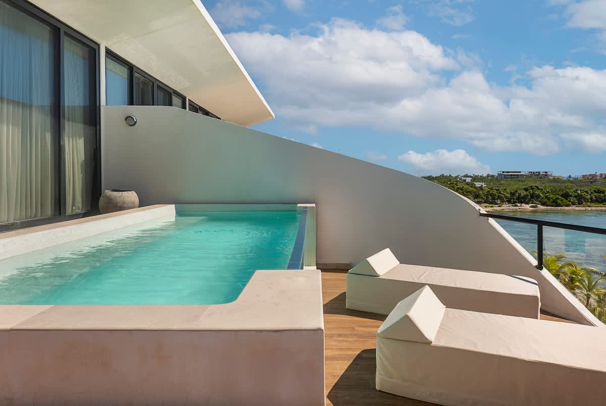 A private terrace featuring a plunge pool and comfortable sunloungers