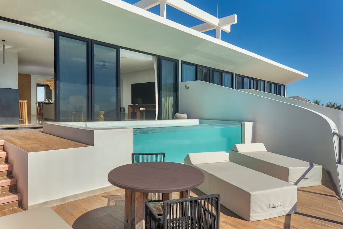 A private terrace featuring a plunge pool and comfortable sunloungers