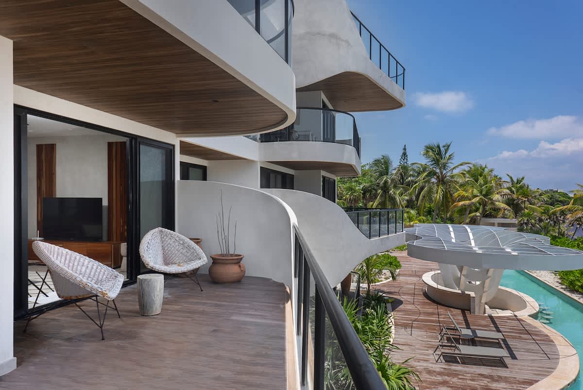 Balcony with ocean and pool views