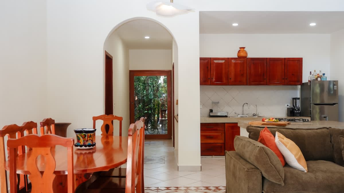 Mexican hacienda–style living room and dining room with warm, authentic charm.