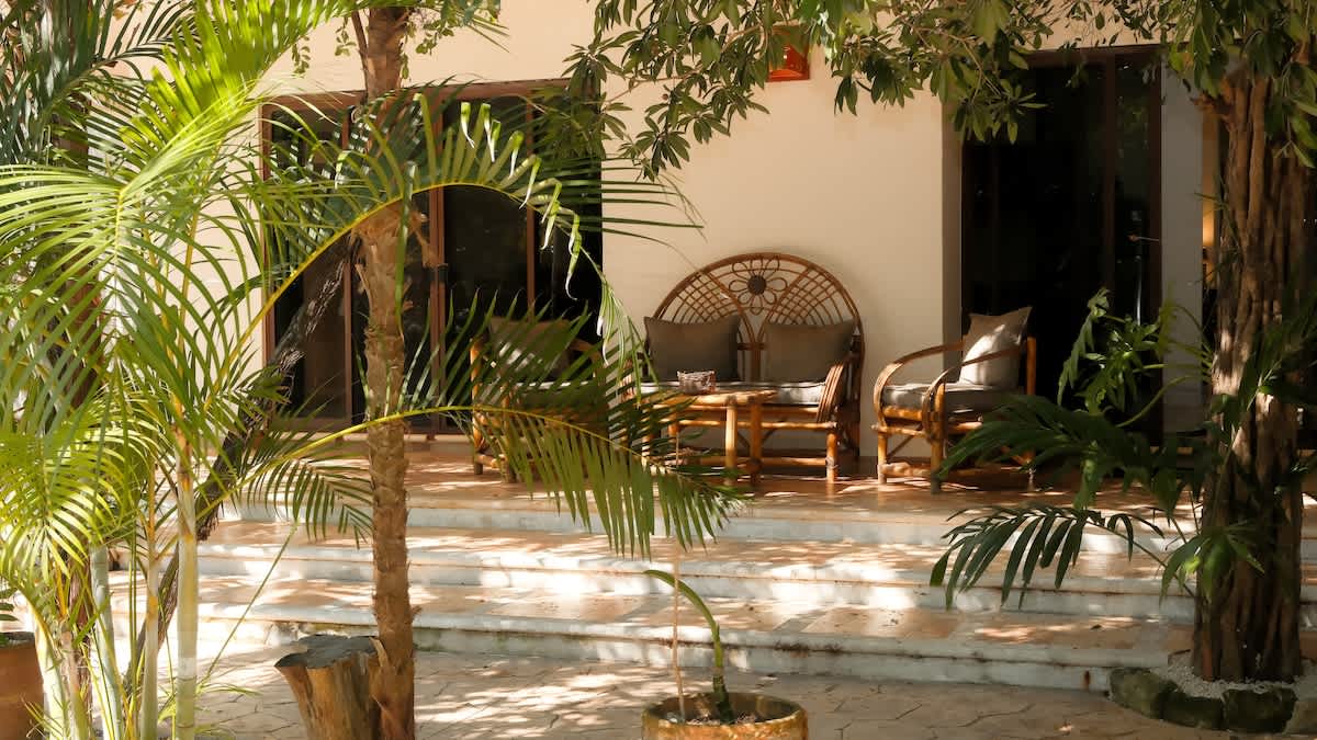 Comfortable outdoor furniture on the patio, ideal for morning coffee and relaxed gatherings.