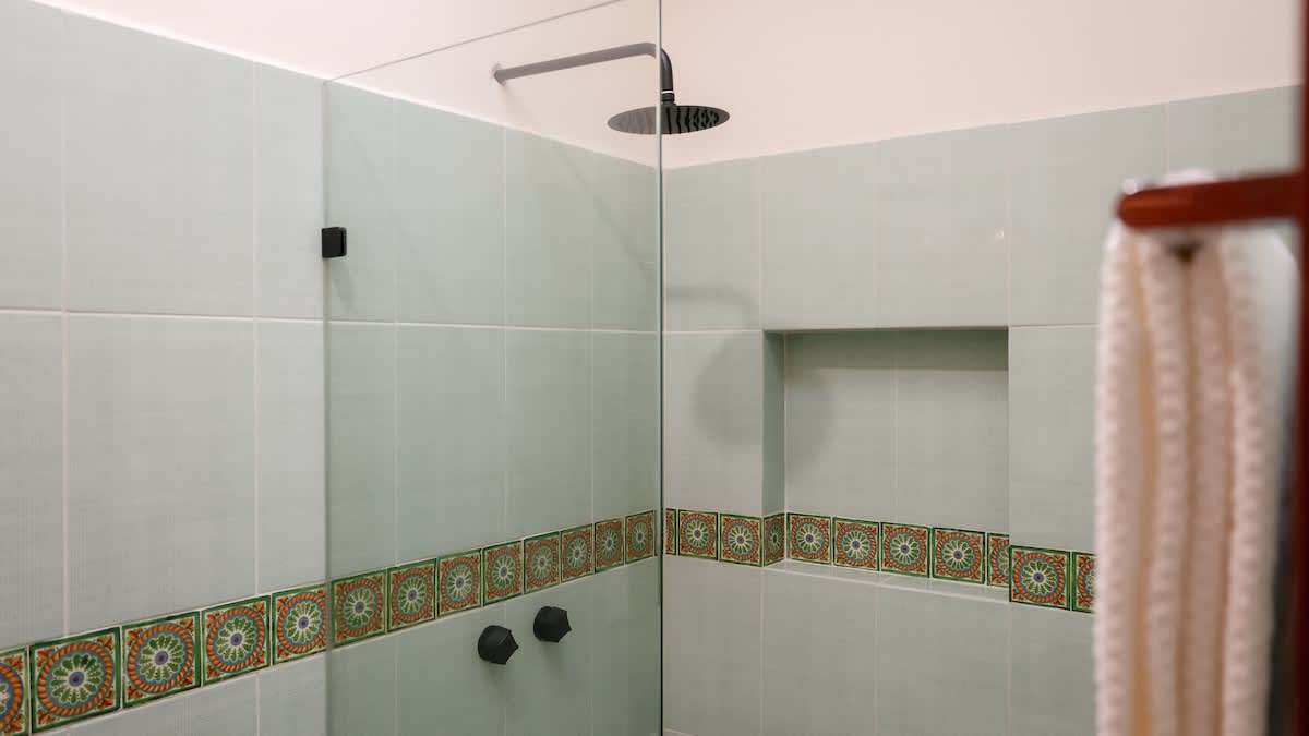 Bathroom #2 
Authentic Mexican hacienda-style bathroom showcasing hand-painted Talavera sinks, bold tilework, and artisanal finishes