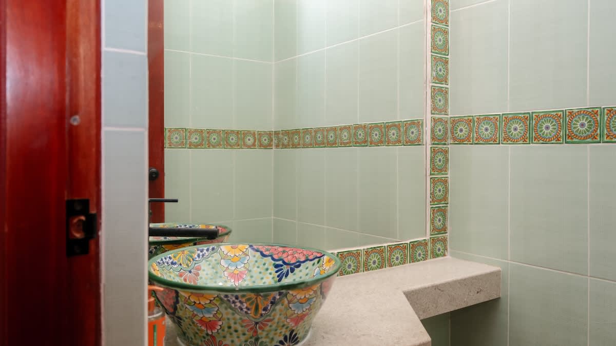 Bathroom #2 
Authentic Mexican hacienda-style bathroom showcasing hand-painted Talavera sinks, bold tilework, and artisanal finishes
